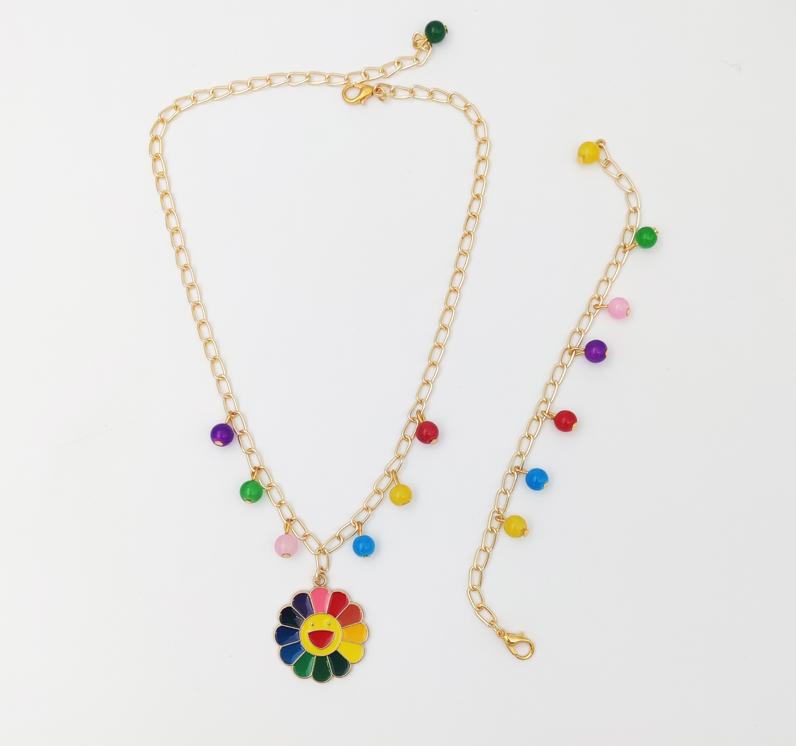 Lime By Manika | Smiley Flower Enameled Charm Necklace & Beaded Bracelet Set, Red, Yellow, Blue, Green undefined