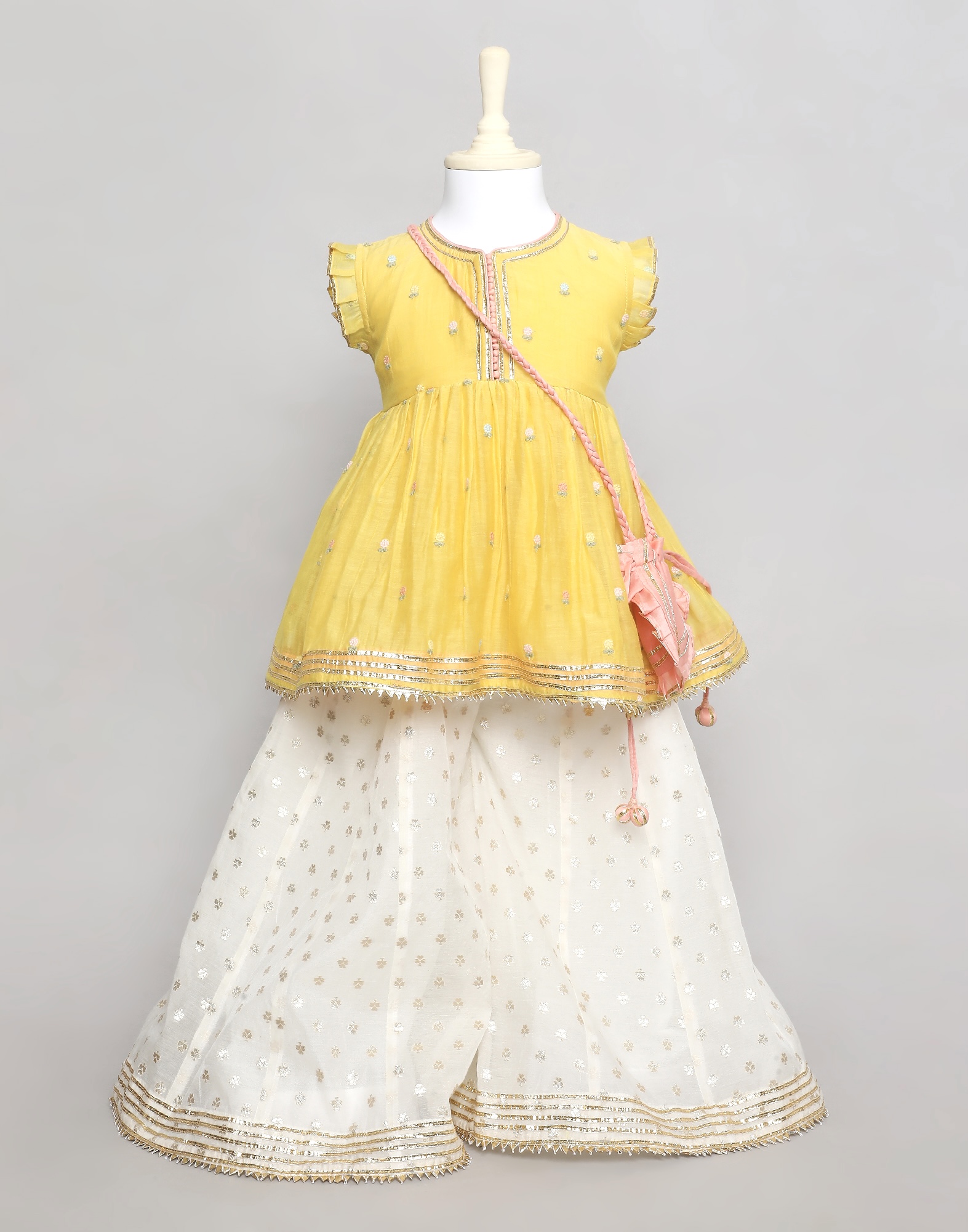 Yellow Chanderi Peplum Top with Thread Work and Ivory Sharrara with Peach Potli Bag