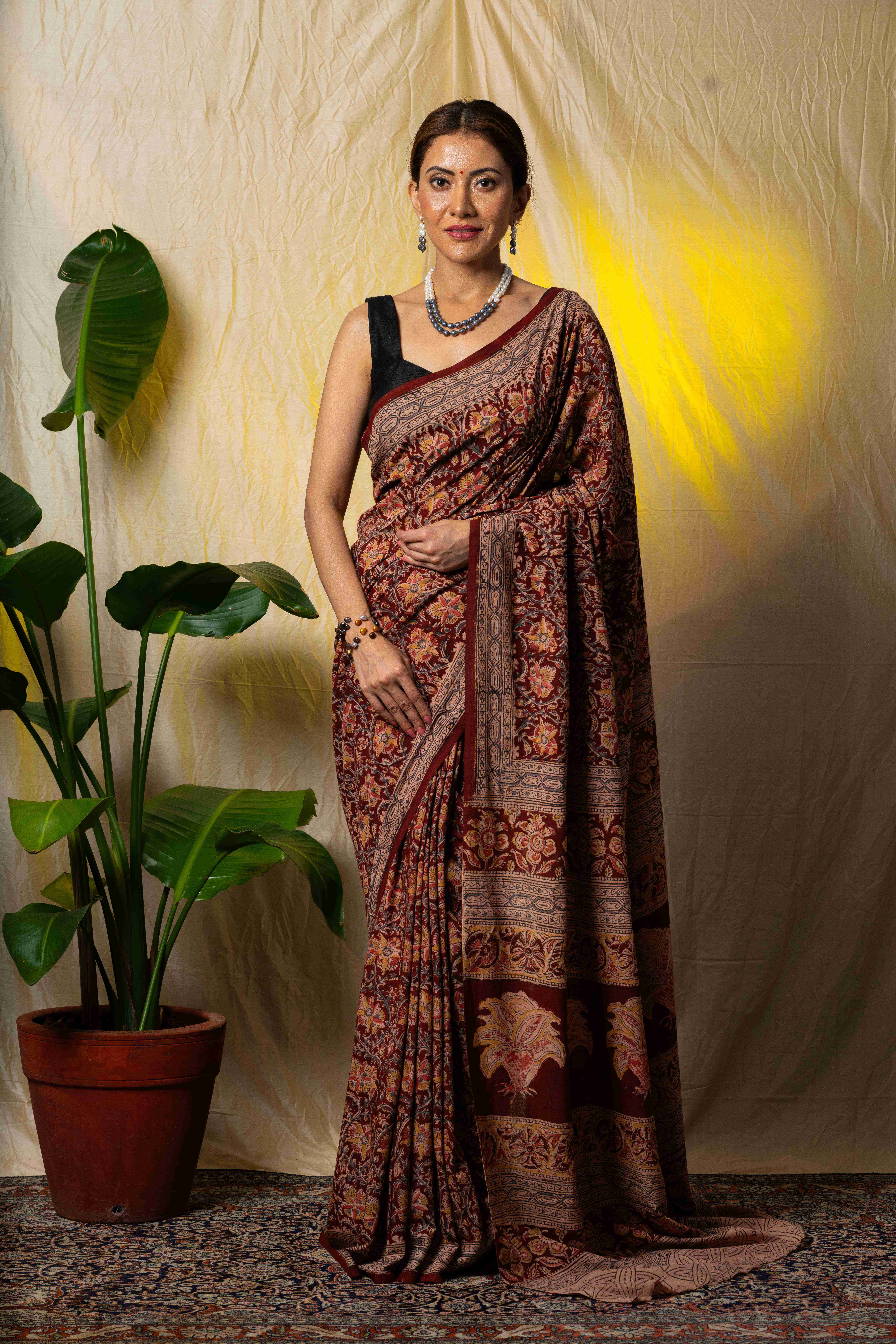 Marron handblock printed kalamkari cotton saree.