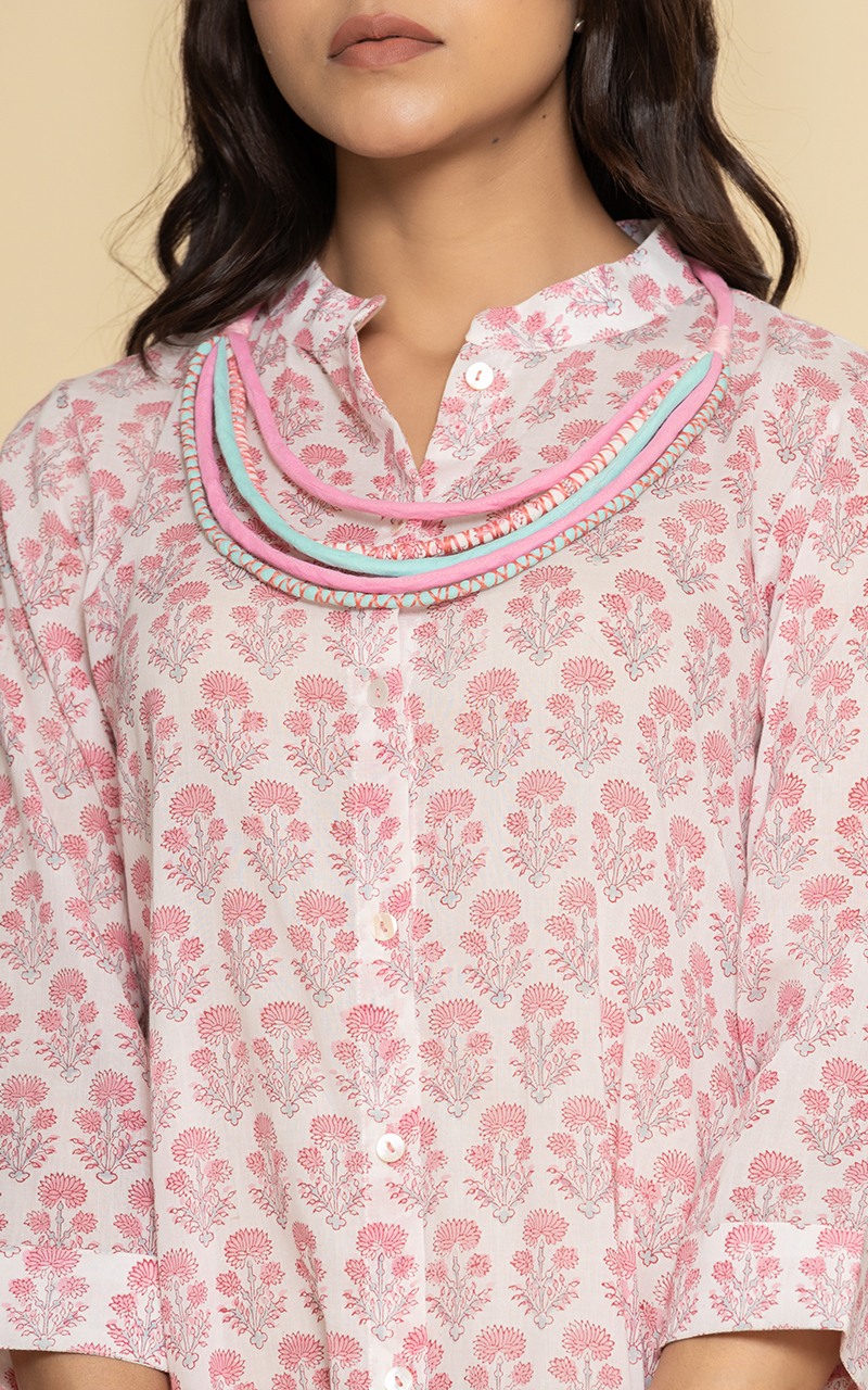 Block printed pink dress with a neckpiece