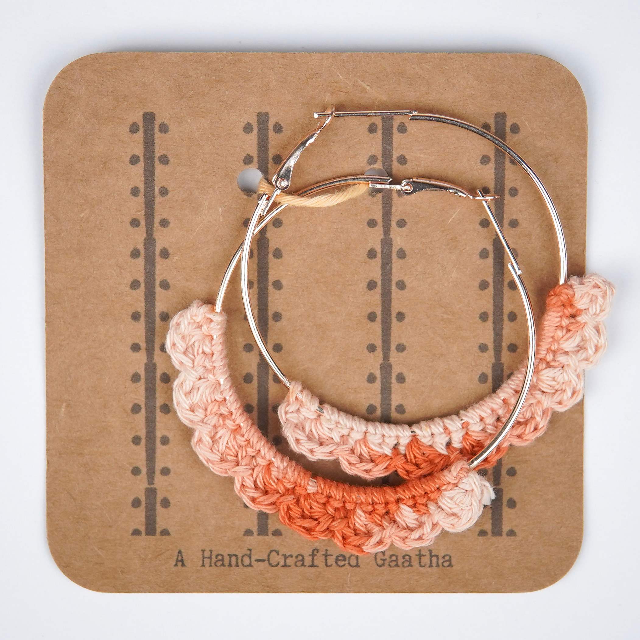 Close-up of AHG's Dual-Shade Peach Crochet Nazakat Hoops. Delicate crochet in a beautiful peach blend!