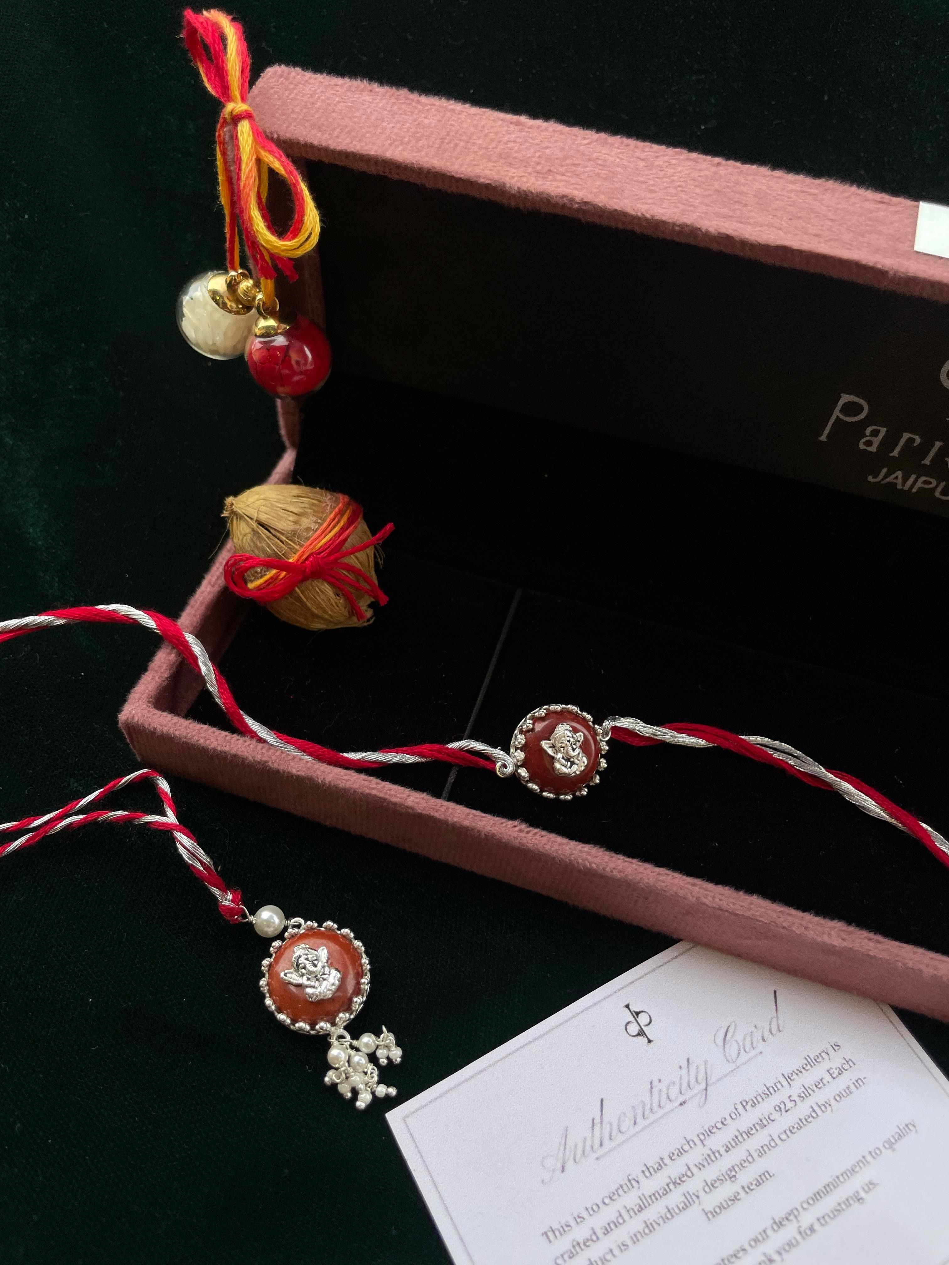 Pair Of Baal Ganesha Rakhi & Lumba In Silver