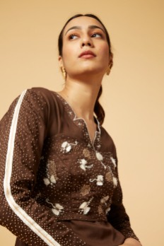 Embroidered bus[er with embellished coat and skirt