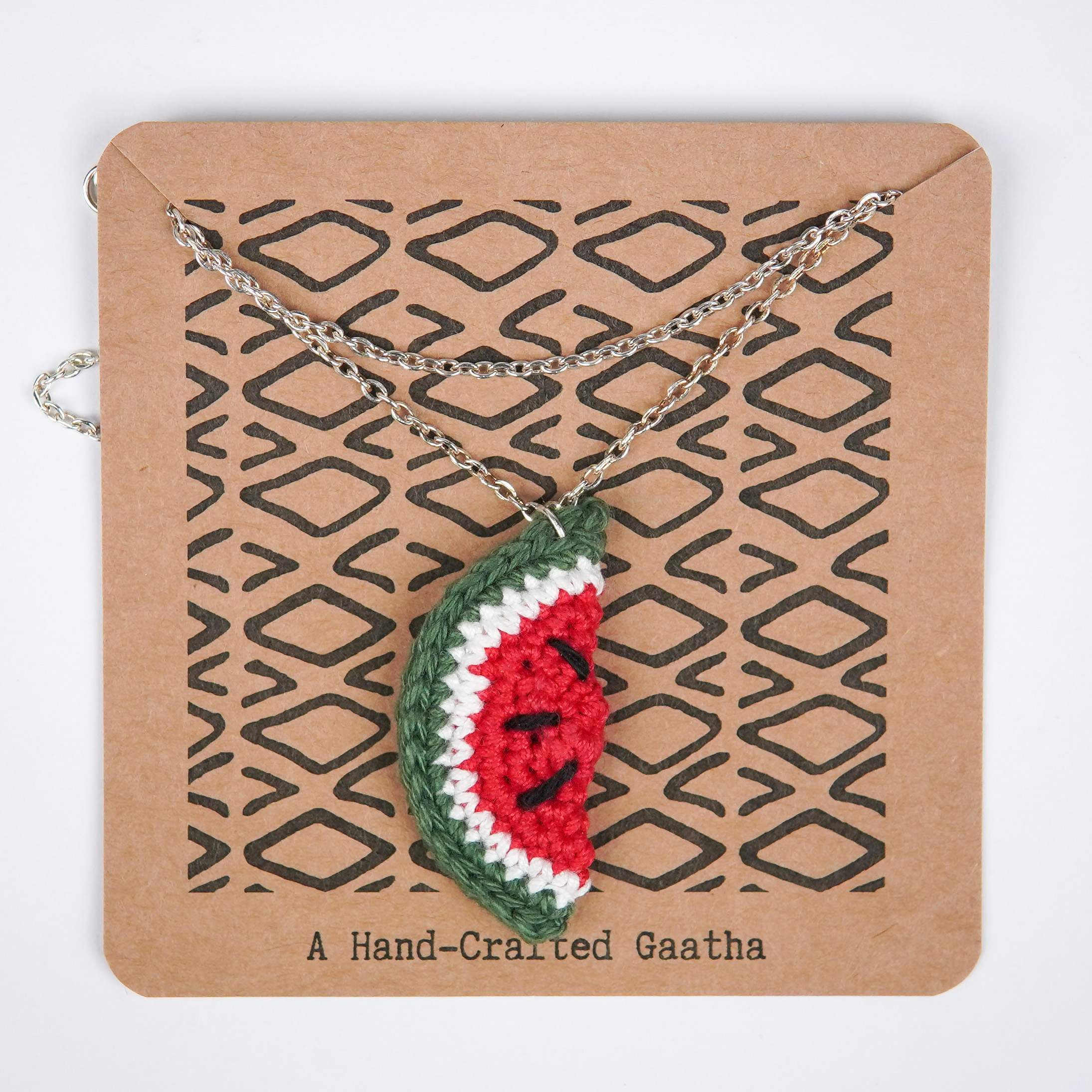 Close-up of AHG's Watermelon Pendant. Delicate details capture the sweetness of summer