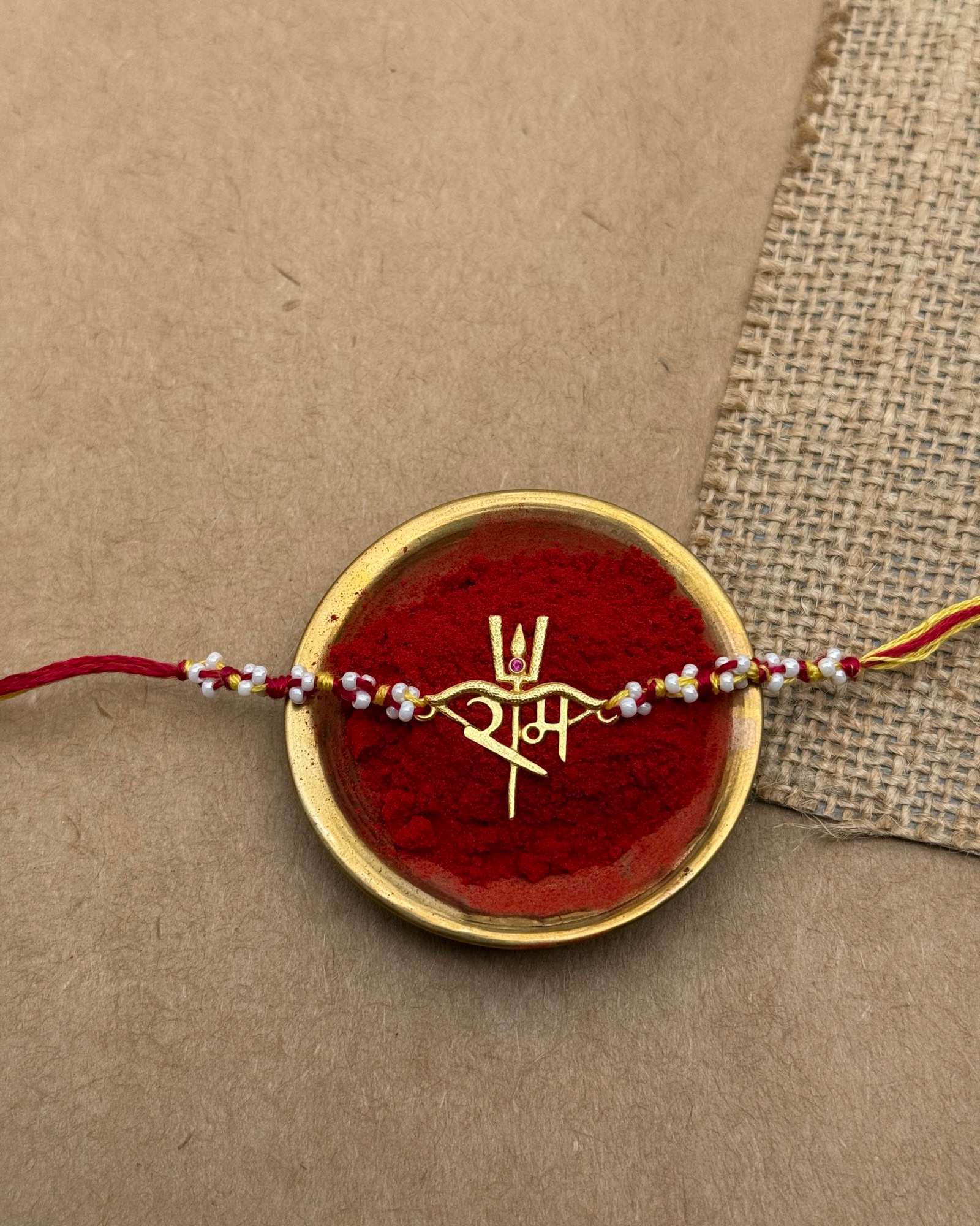 Ram Rakhi in 18k plated gold