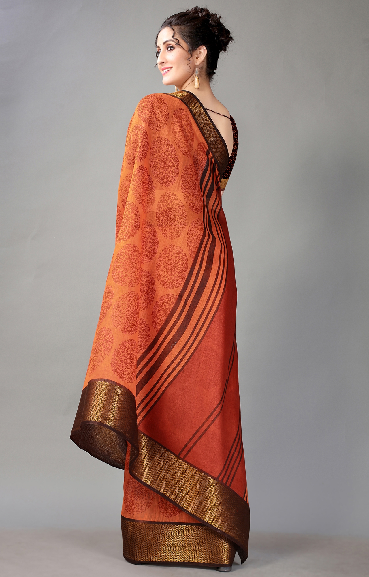 Orange matka silk with zari checks and wide zari temple border Saree