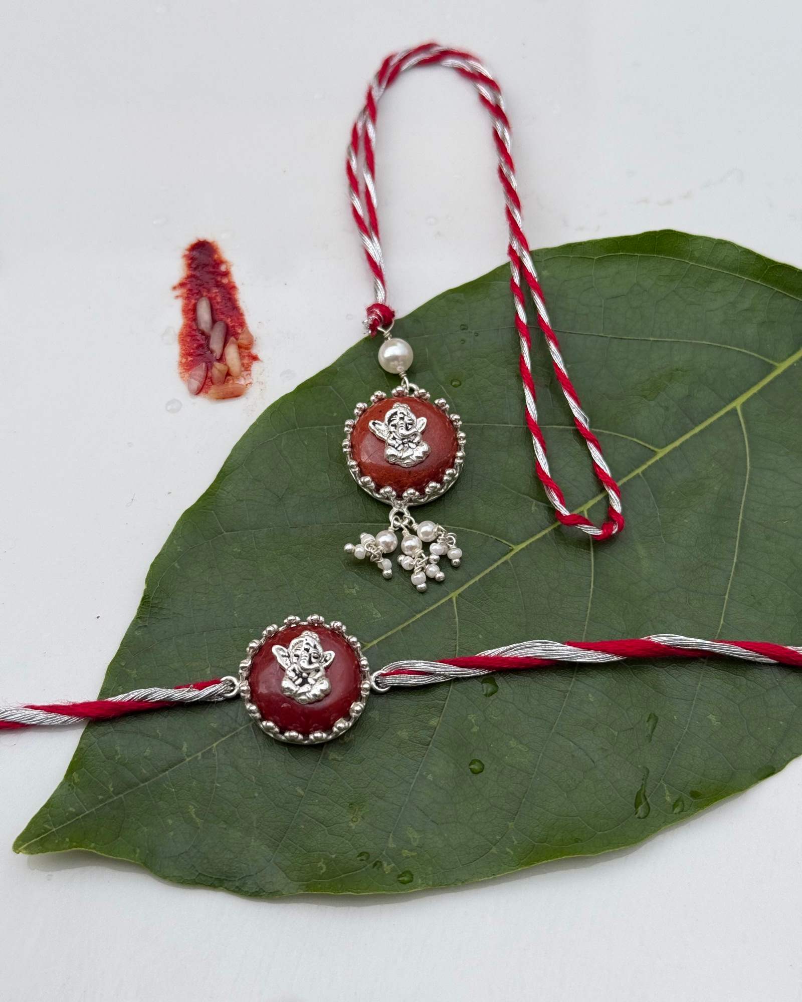 Pair Of Baal Ganesha Rakhi & Lumba In Silver