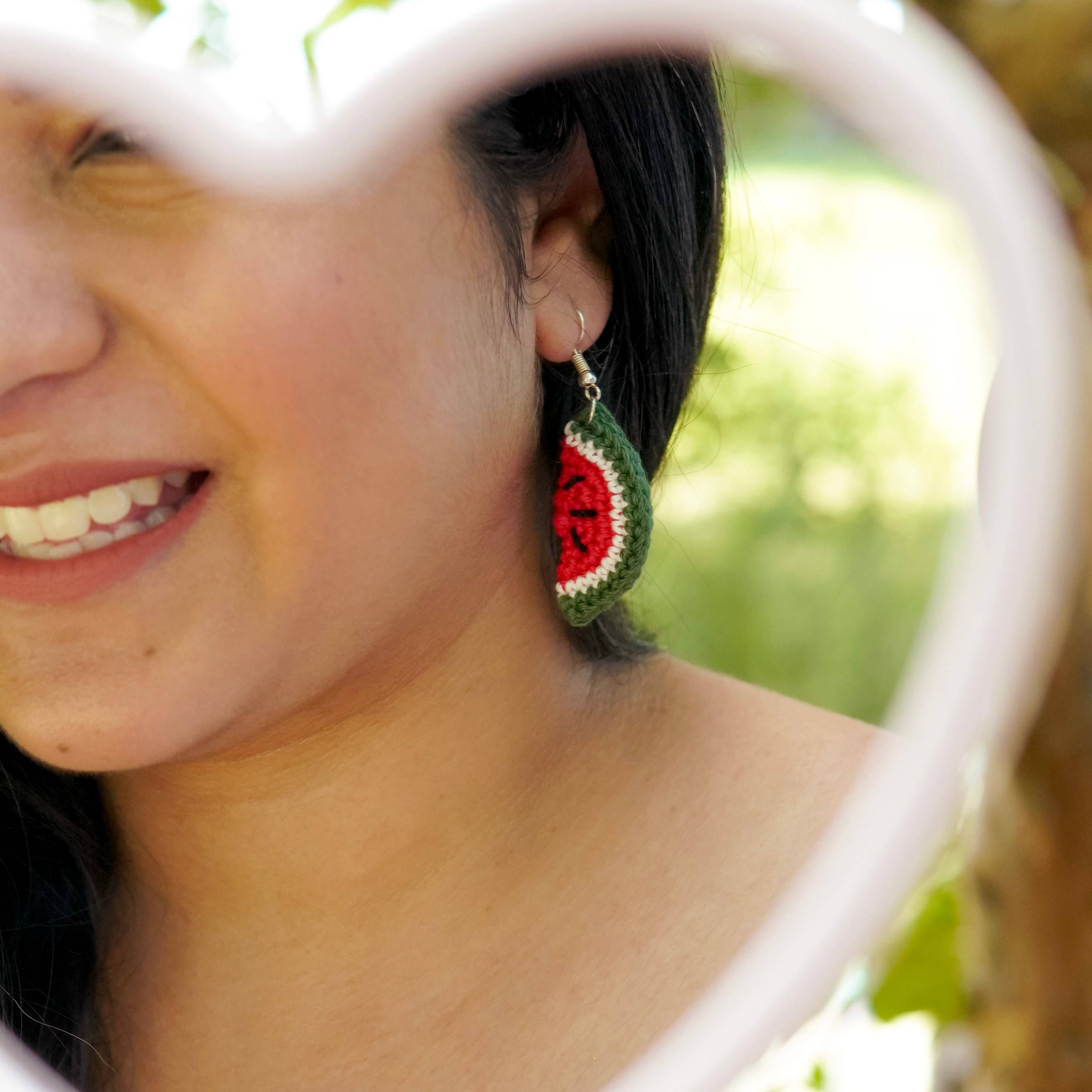 Model wearing the Watermelon Earrings by AHG. Perfect for summer vibes!