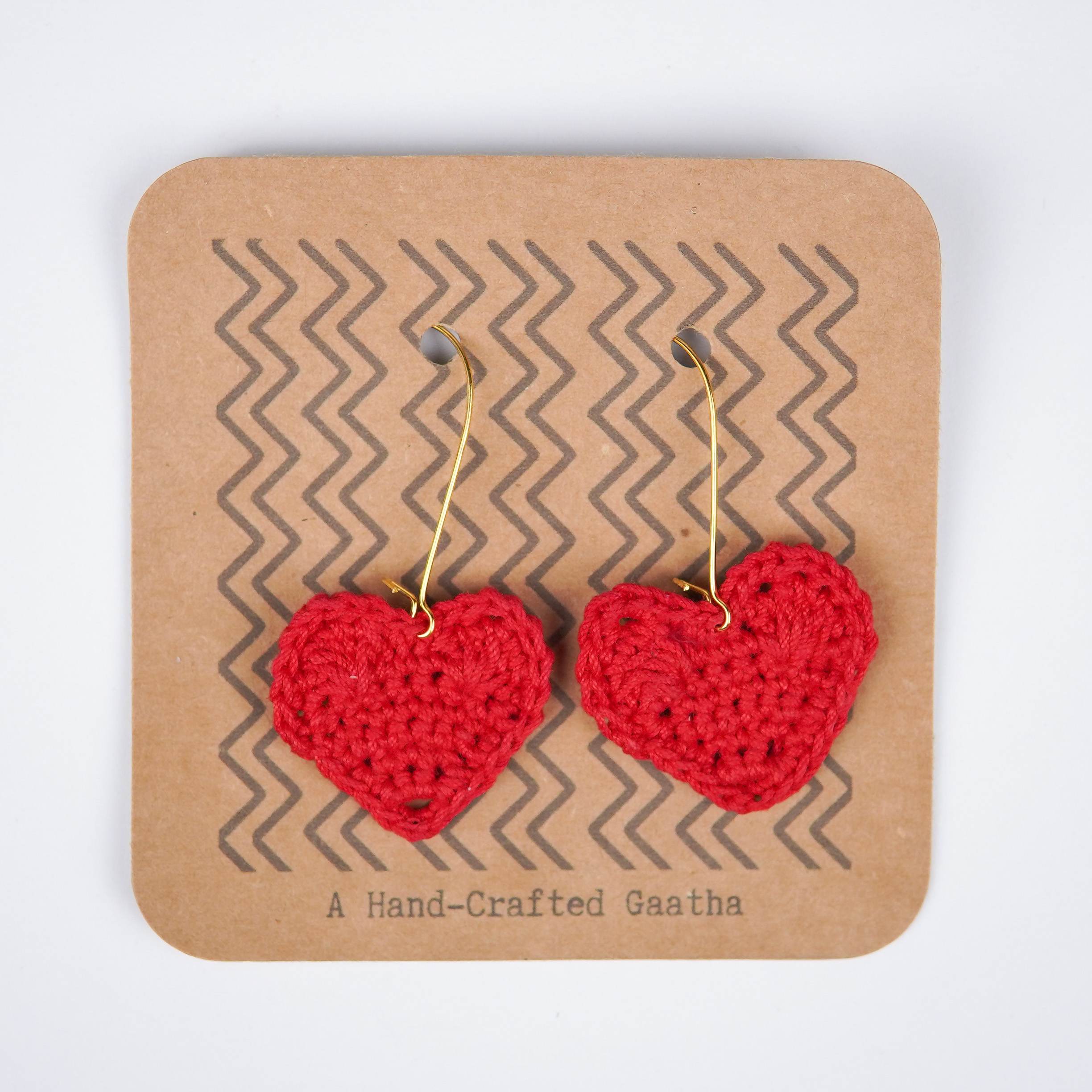 Close-up views of adorable crochet heart earrings. Lightweight and perfect for any occasion