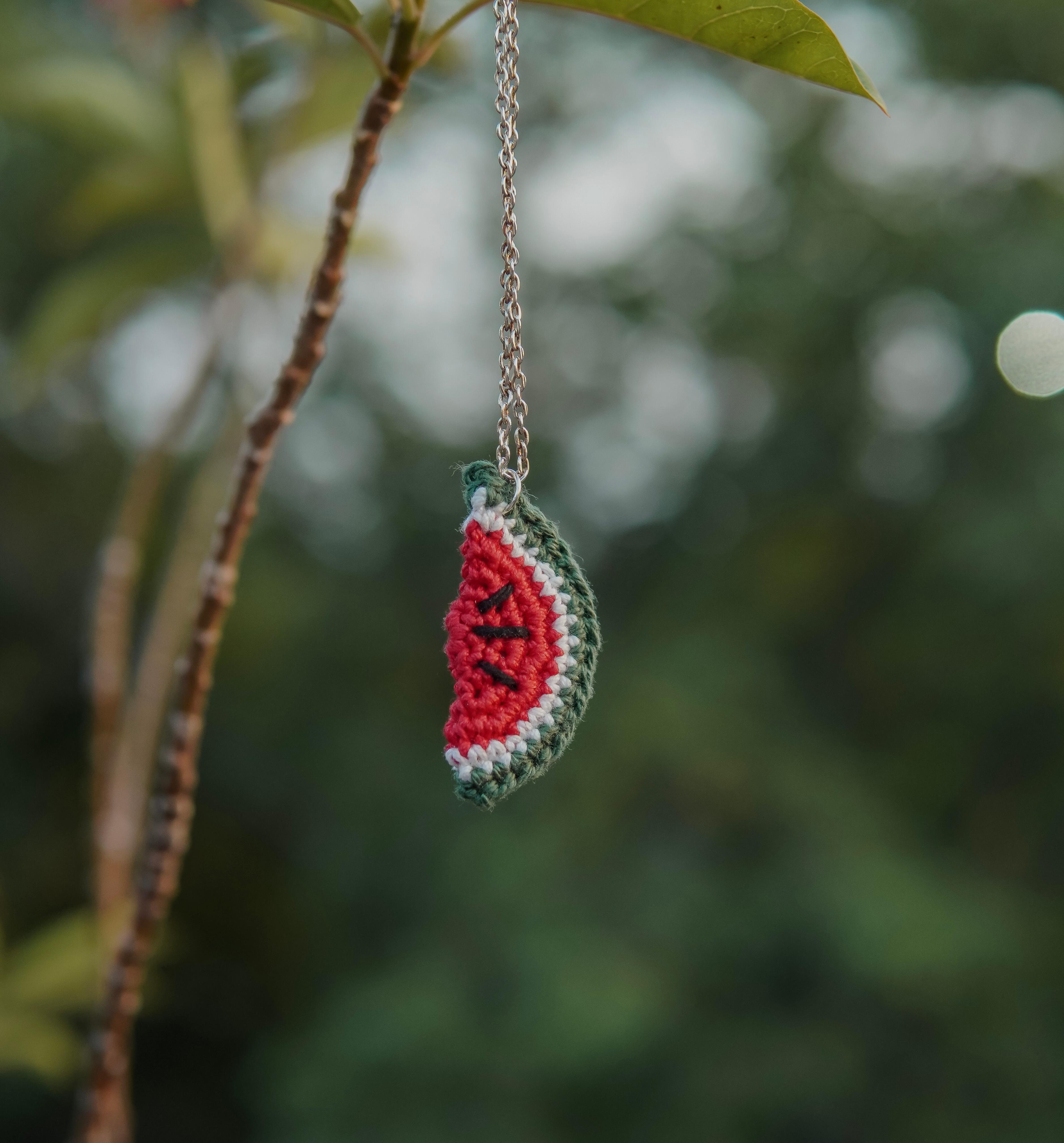 Model wearing the Watermelon Pendant by AHG. Perfect summer accessory!