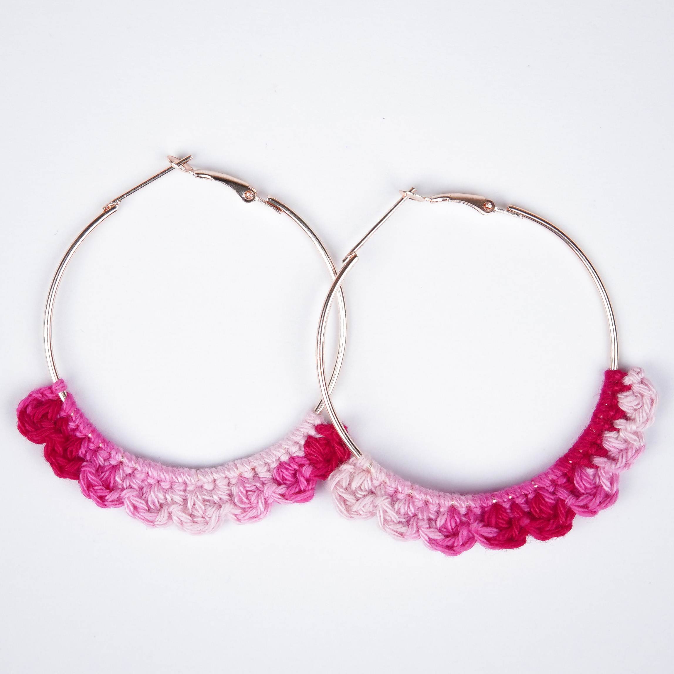 Close-up of AHG's Dual Pink Crochet Nazakat Hoops. Delicate crochet in two shades.