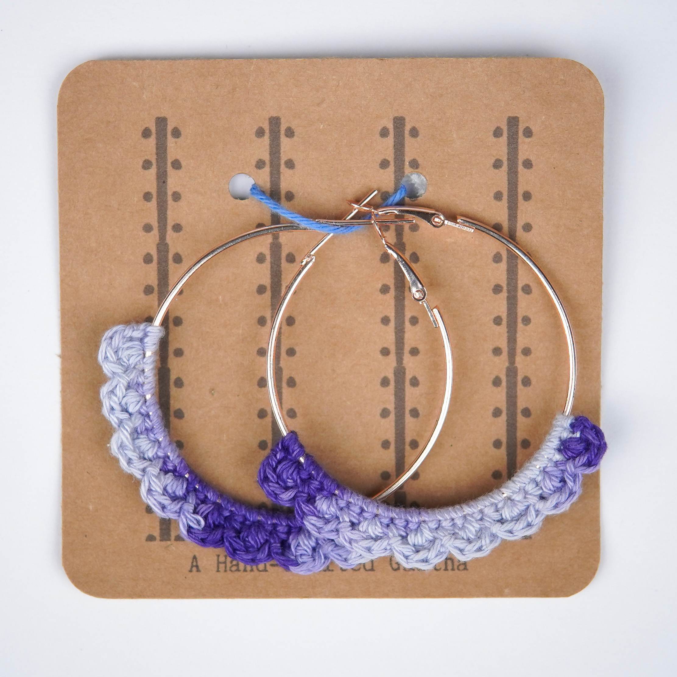 Close-up of AHG's Dual-Shade Lavender Crochet Nazakat Hoops. Delicate crochet in a beautiful blend of lavender!