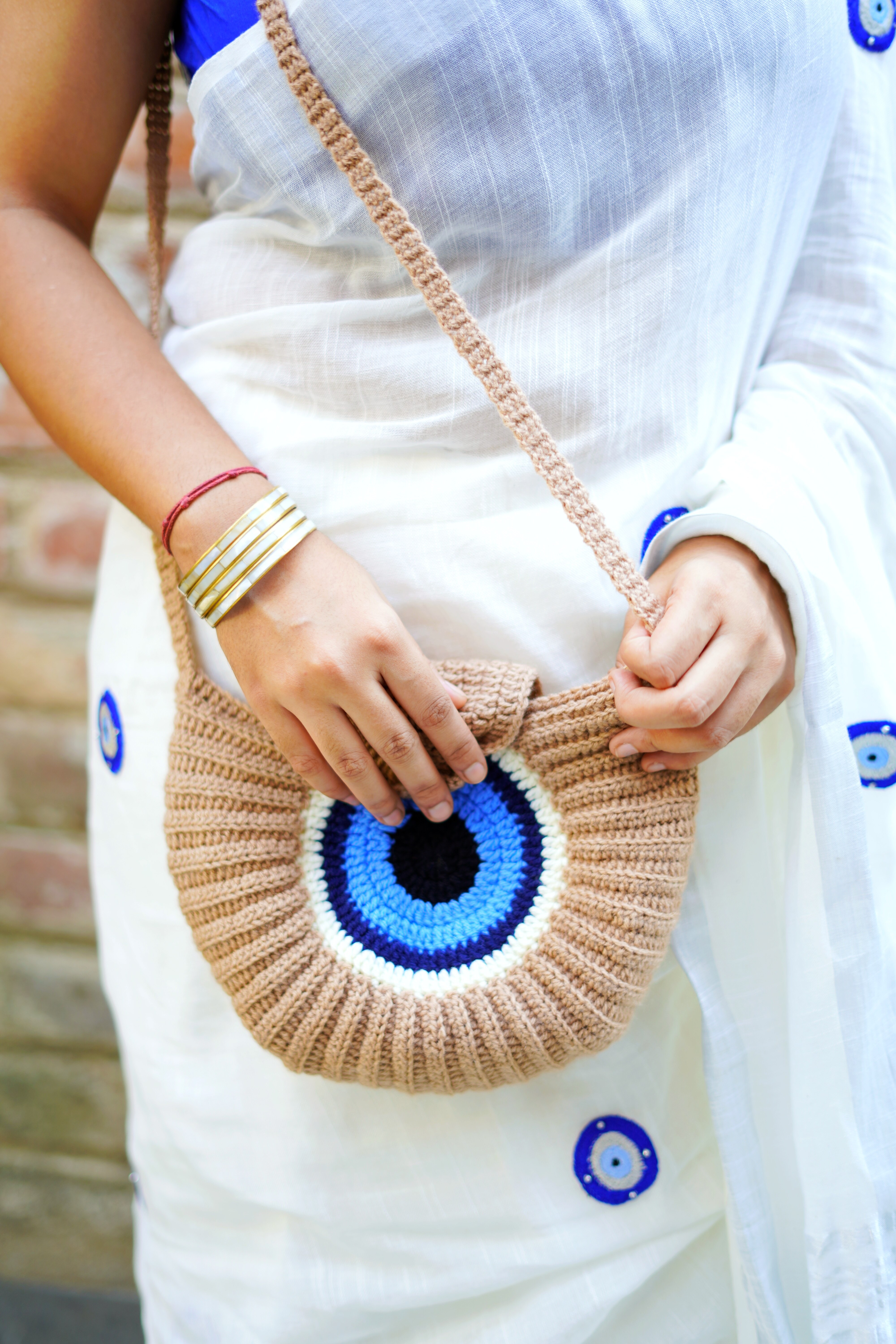 Dori Calcutta | Evil eye crochet tassel bag