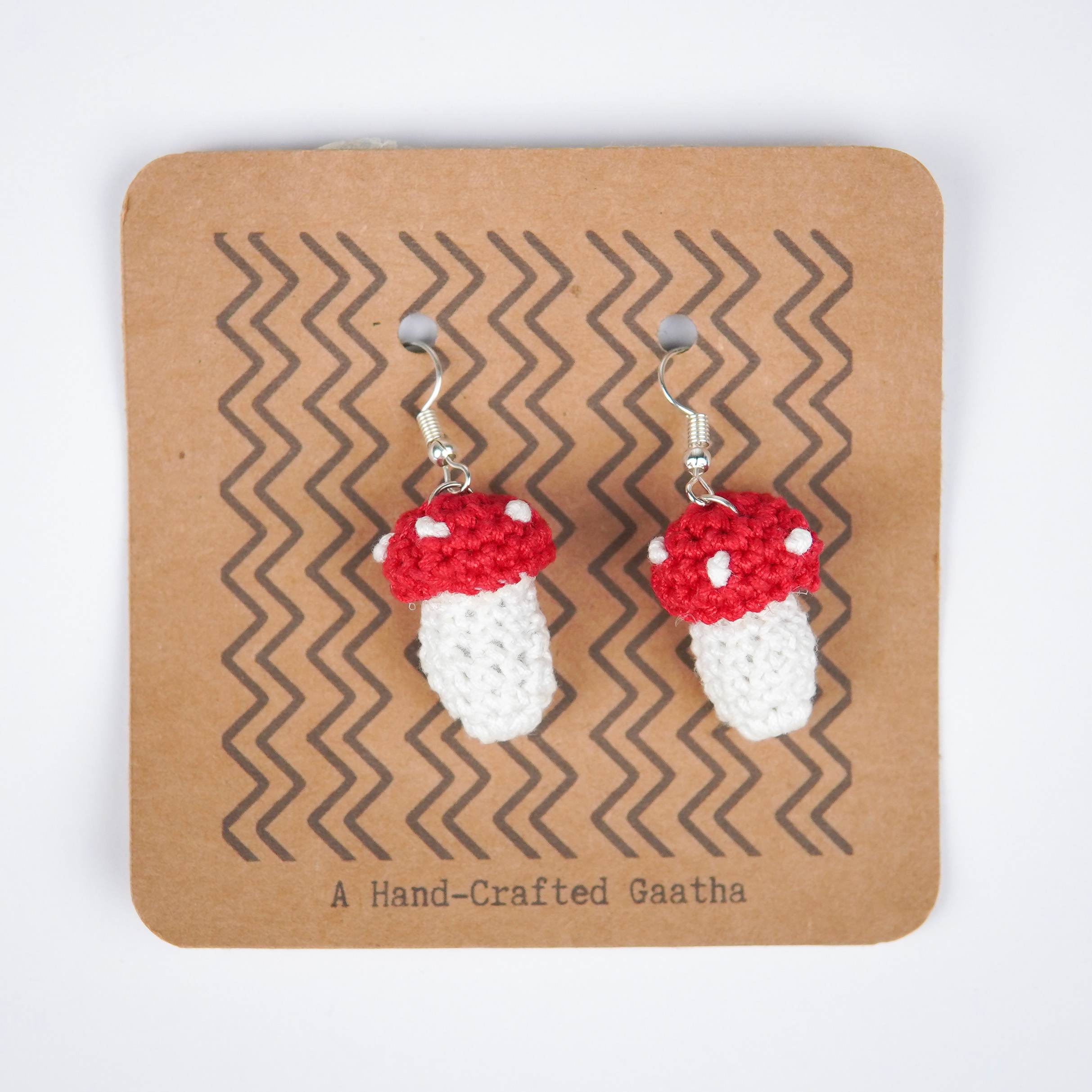 Close-up of AHG's Mushroom Earrings. Delicate details capture the beauty of nature.