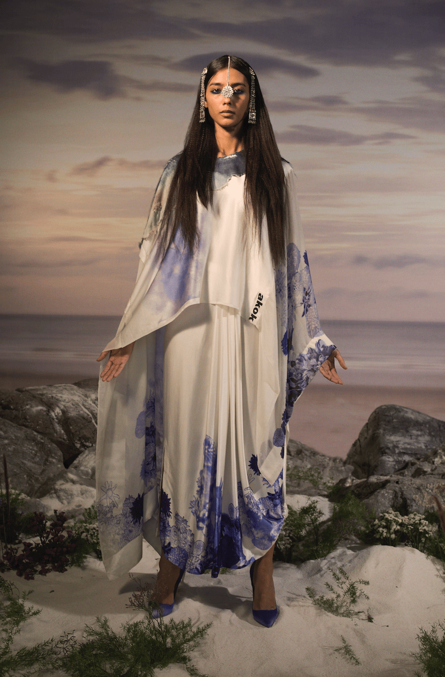 OVERSIZED CAPE WITH DRAPED SKIRT