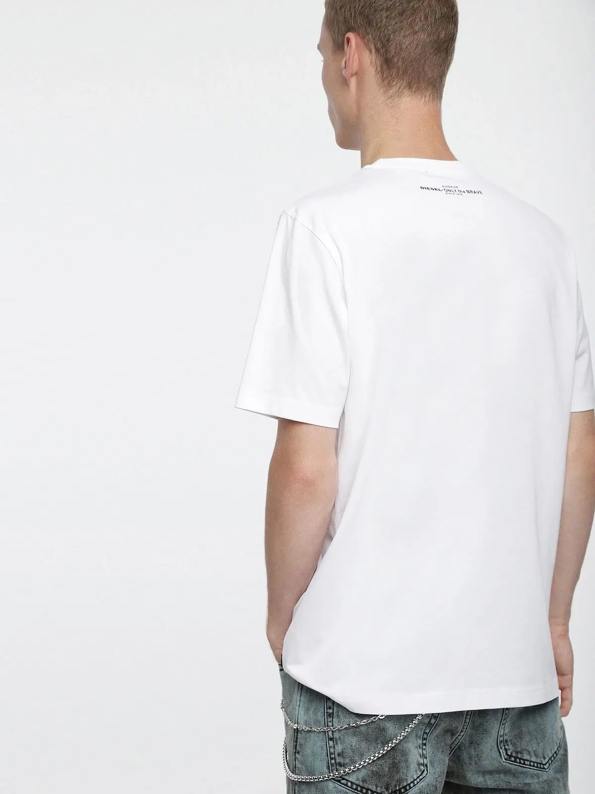White T-Shirt with lettering over a bold print