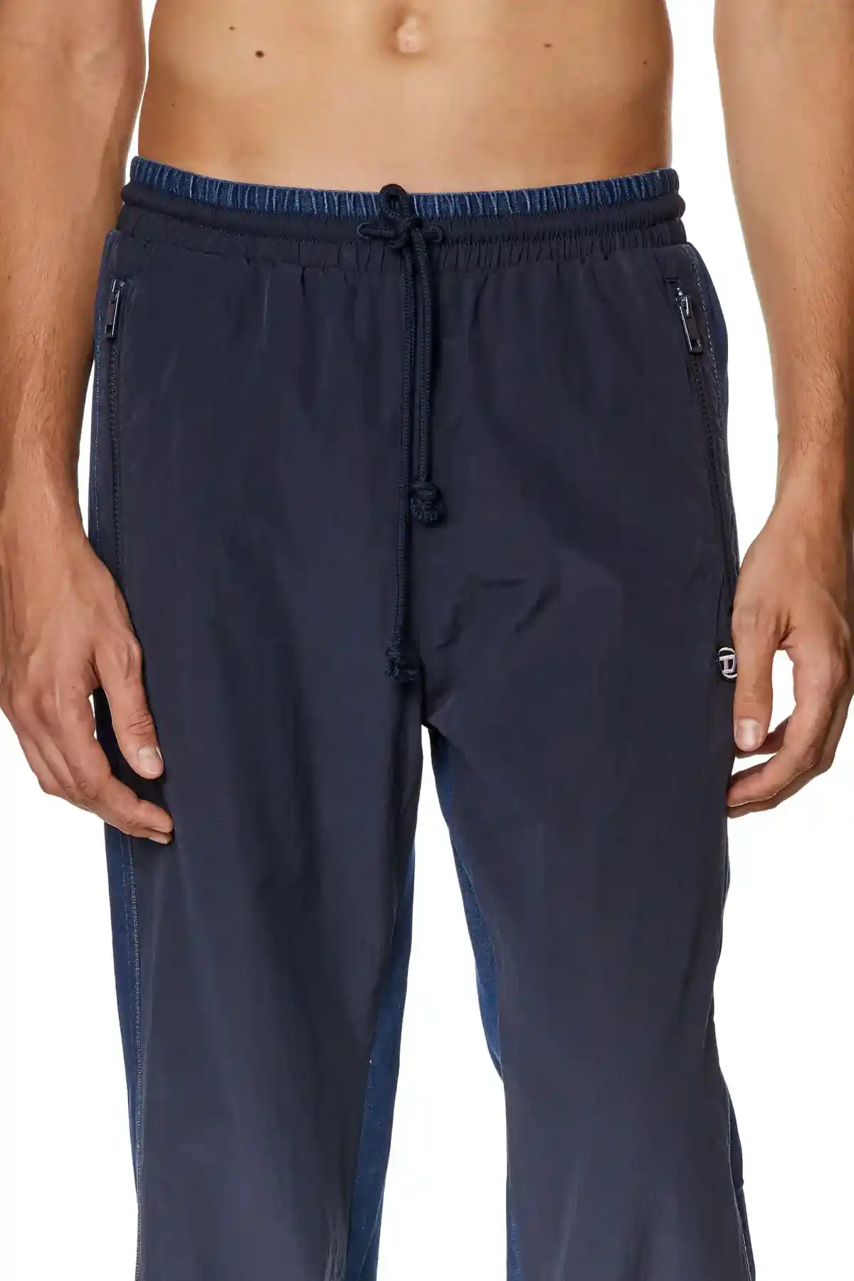 Blue Track pants in wrinkled nylon and denim