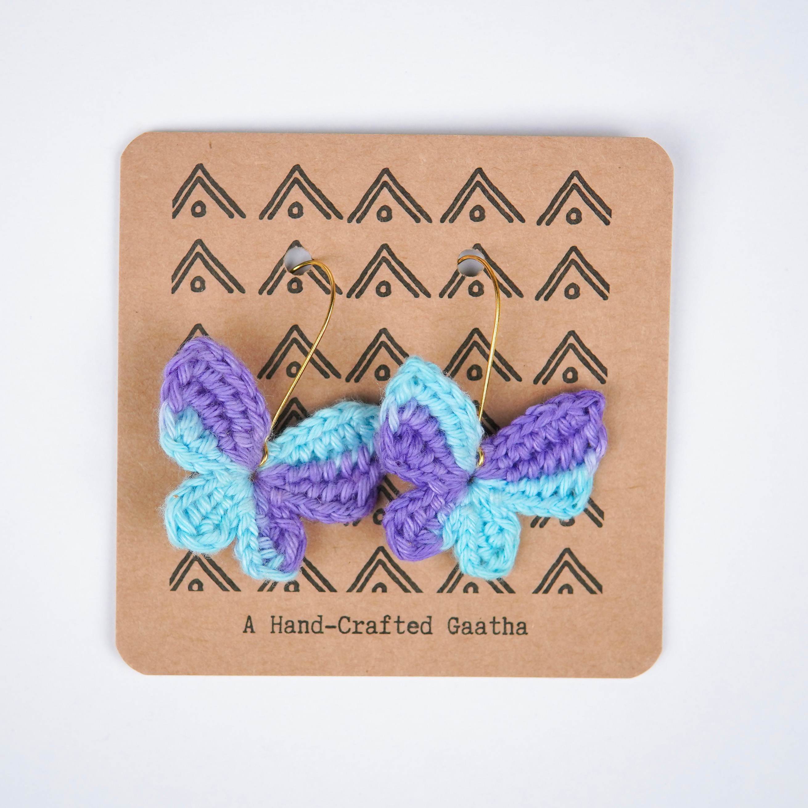 Close-up of the intricate crochet details and the captivating blue & purple shades of the titli earrings