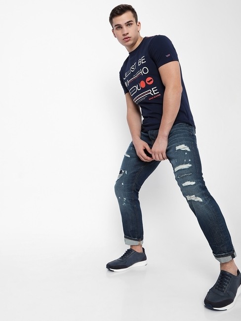 Norton Mid-Wash Distressed Tapered Jeans