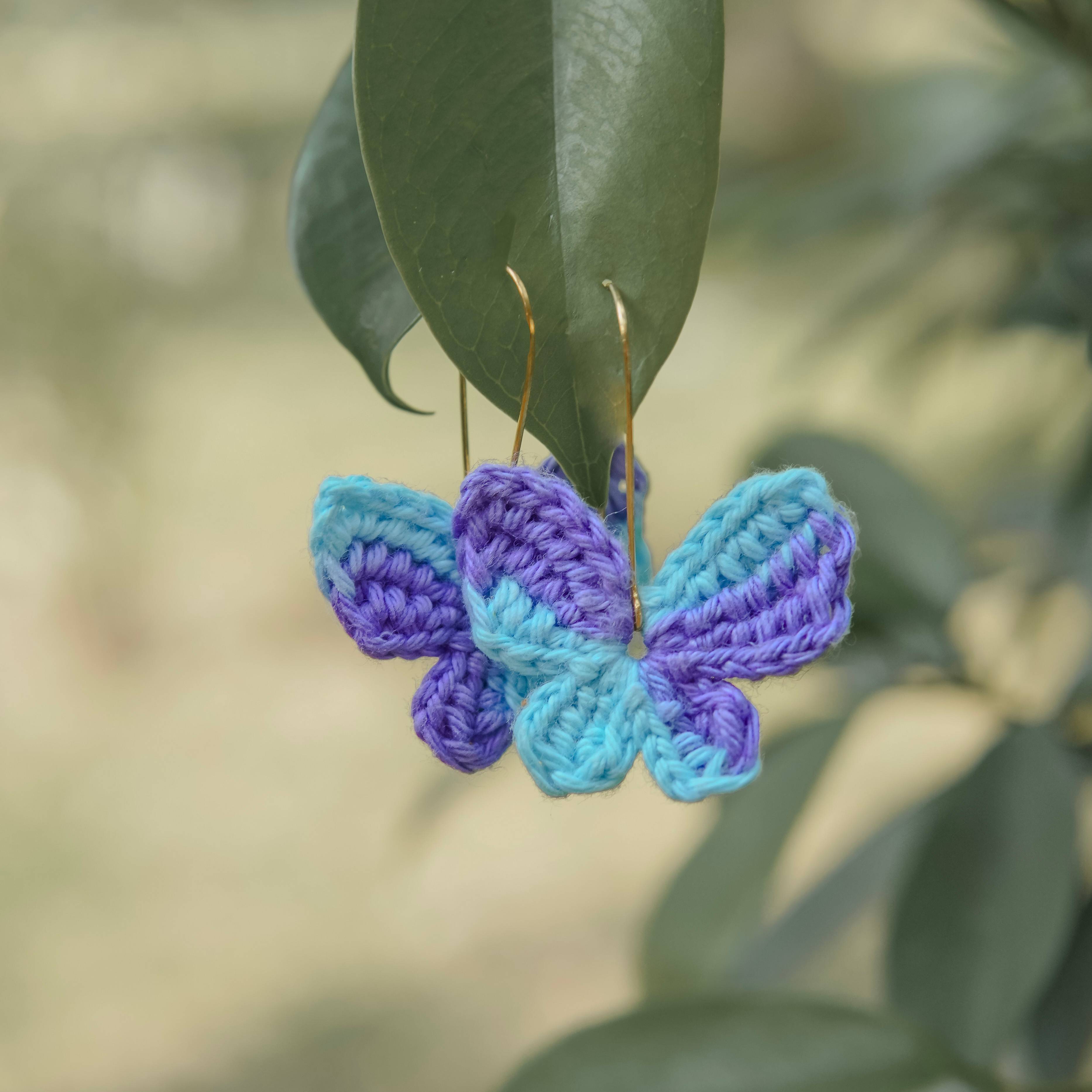 A Handcrafted Gaatha - Blue & Purple Titli Crochet Earrings. Handcrafted magic for your ears!