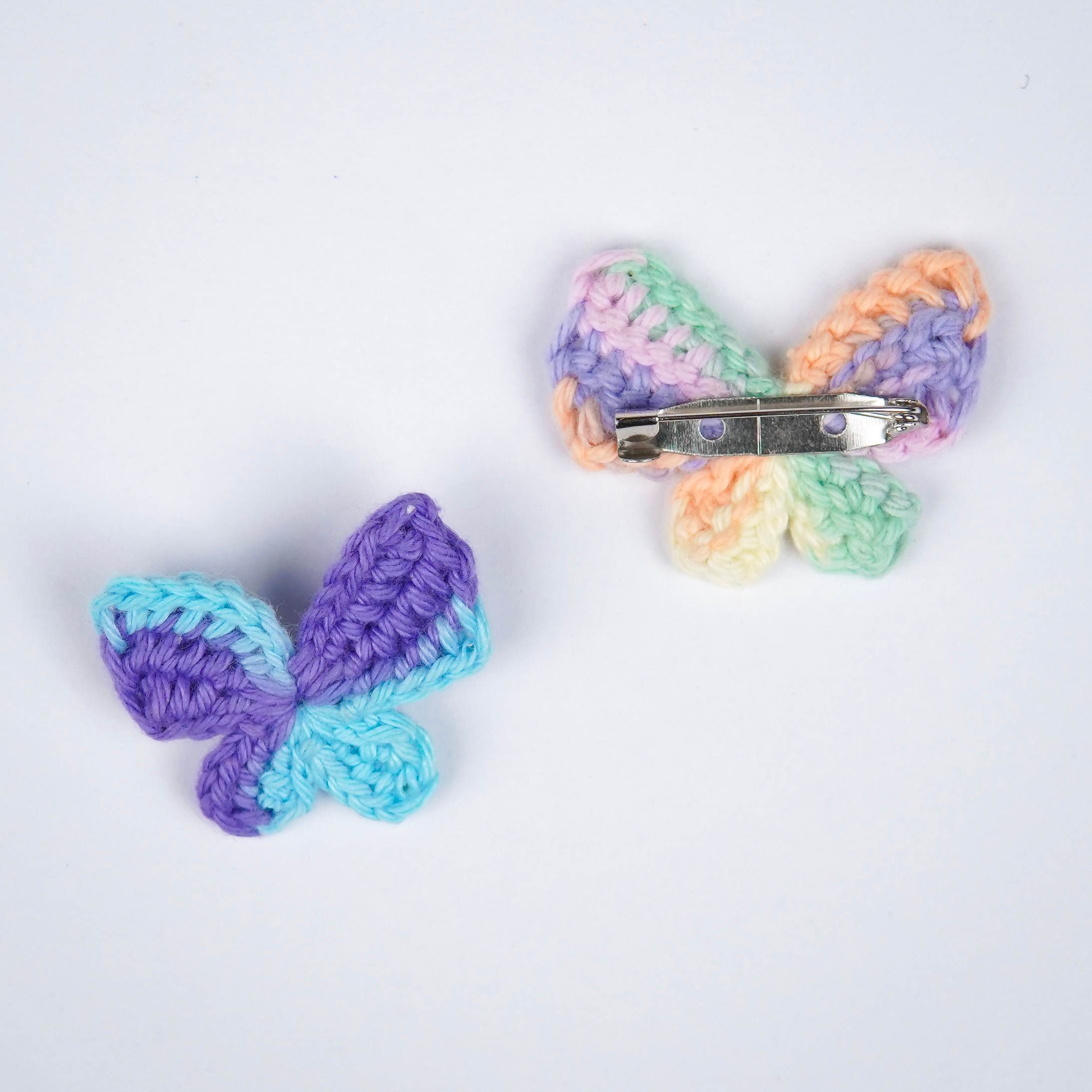 Close-up of AHG's Blue Titli Brooch. Delicate crochet details in a calming shade.