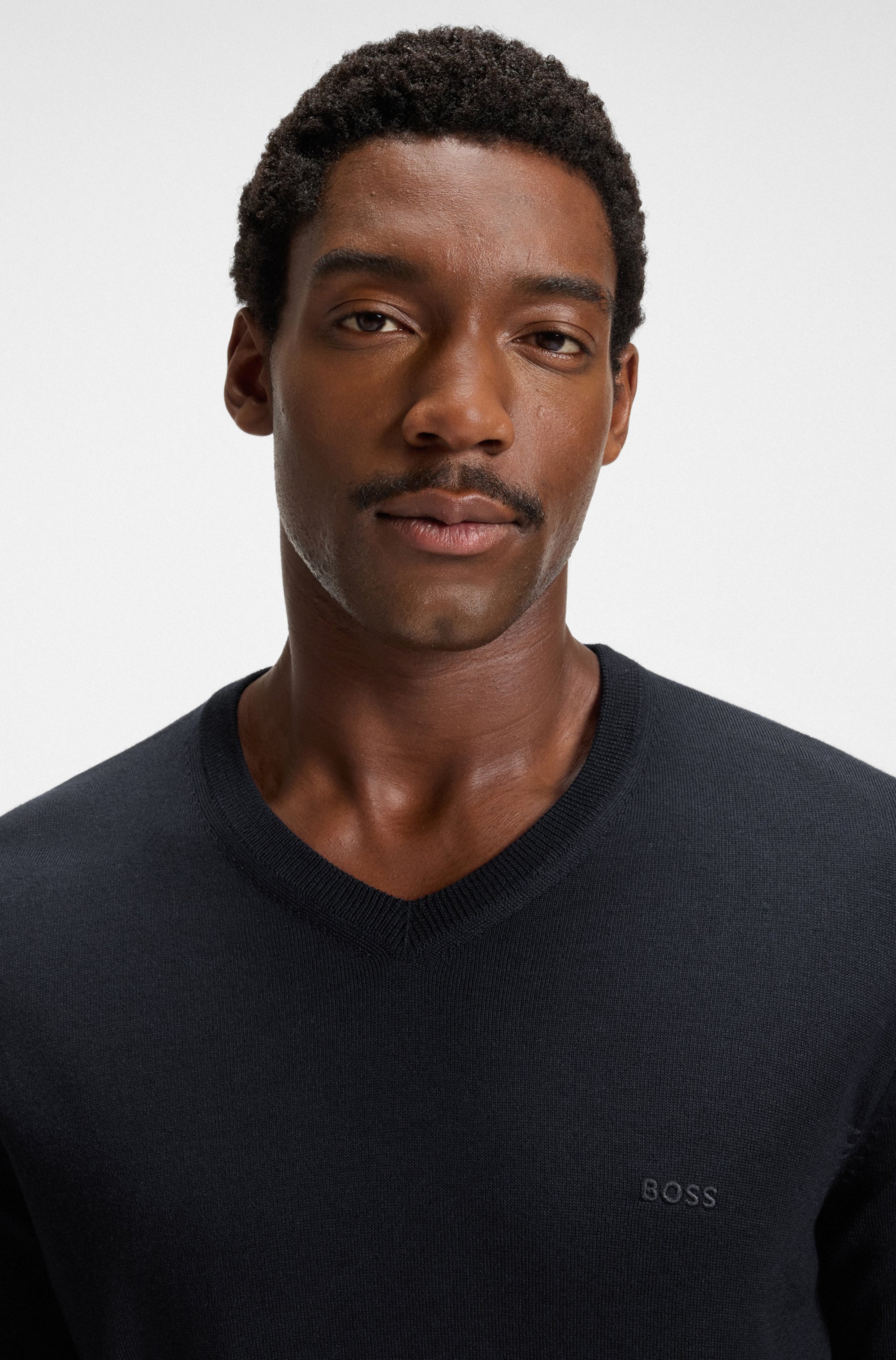 V-neck sweater in virgin wool with embroidered logo