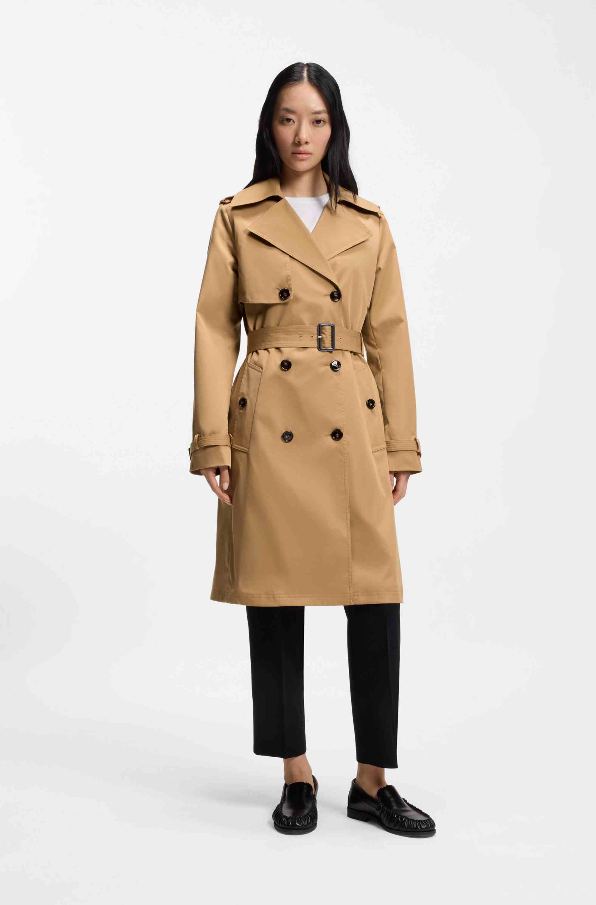 Double-breasted trench coat with buckled belt
