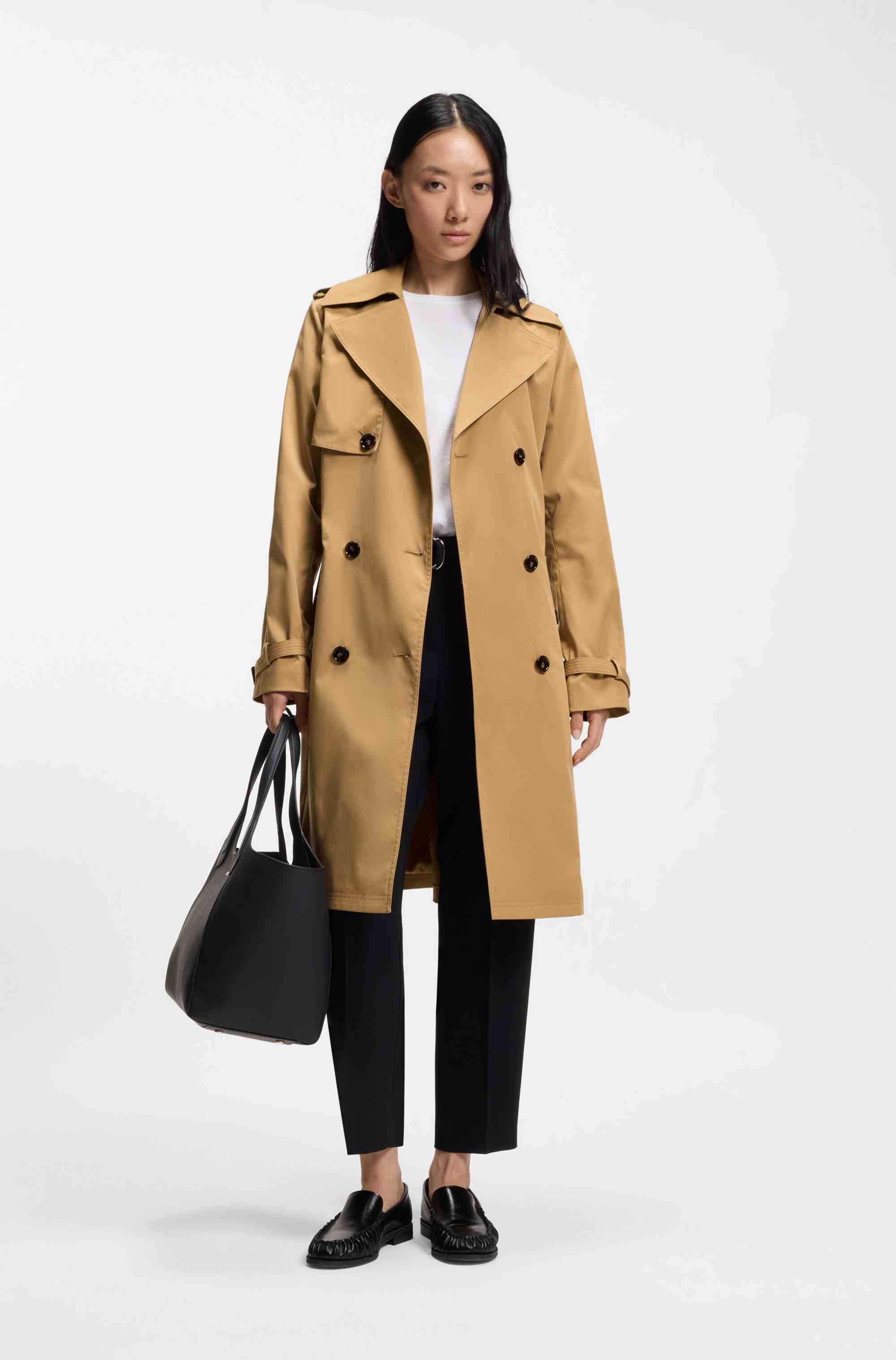 Double-breasted trench coat with buckled belt