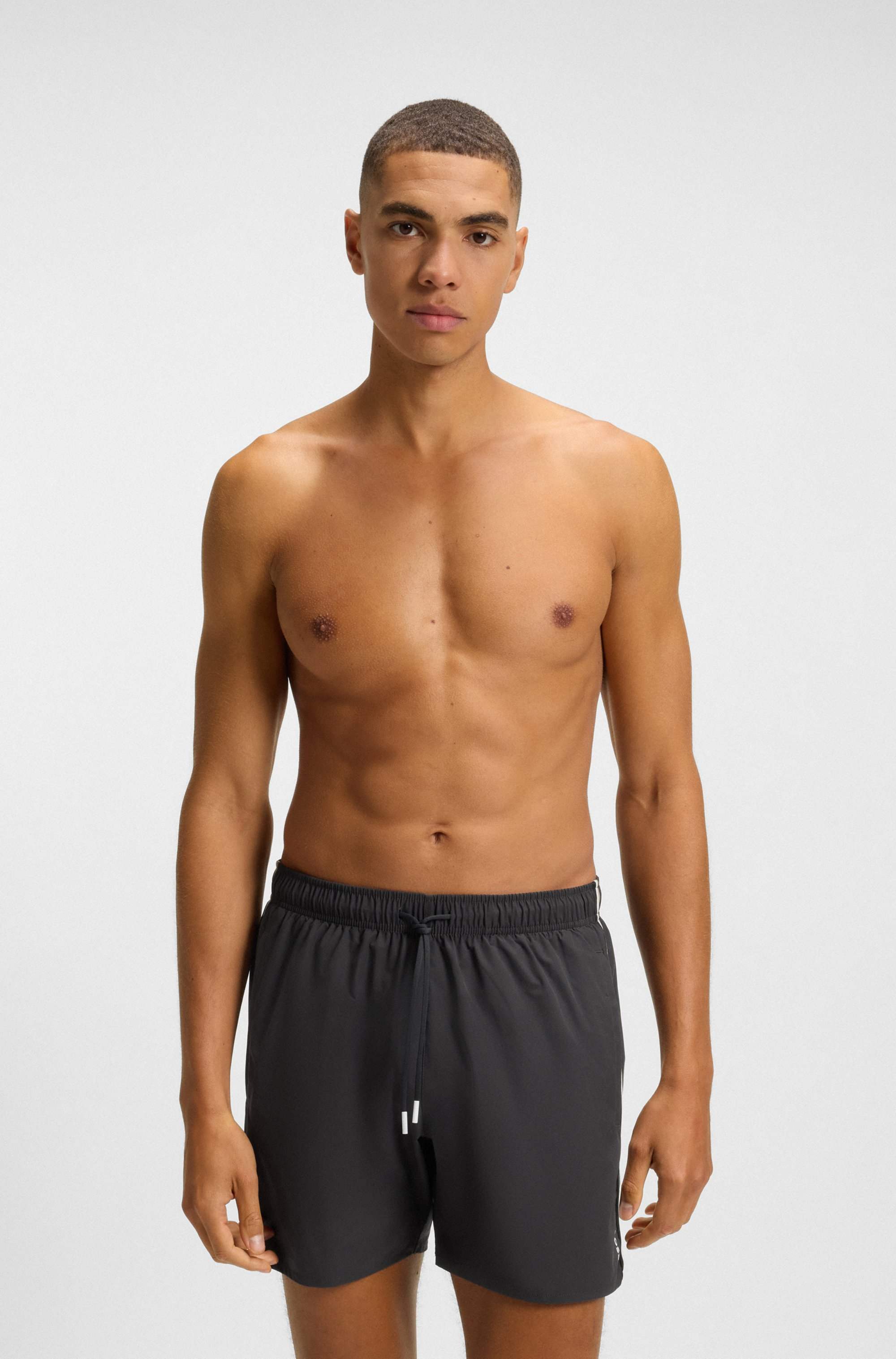 Swim shorts with signature stripe and logo