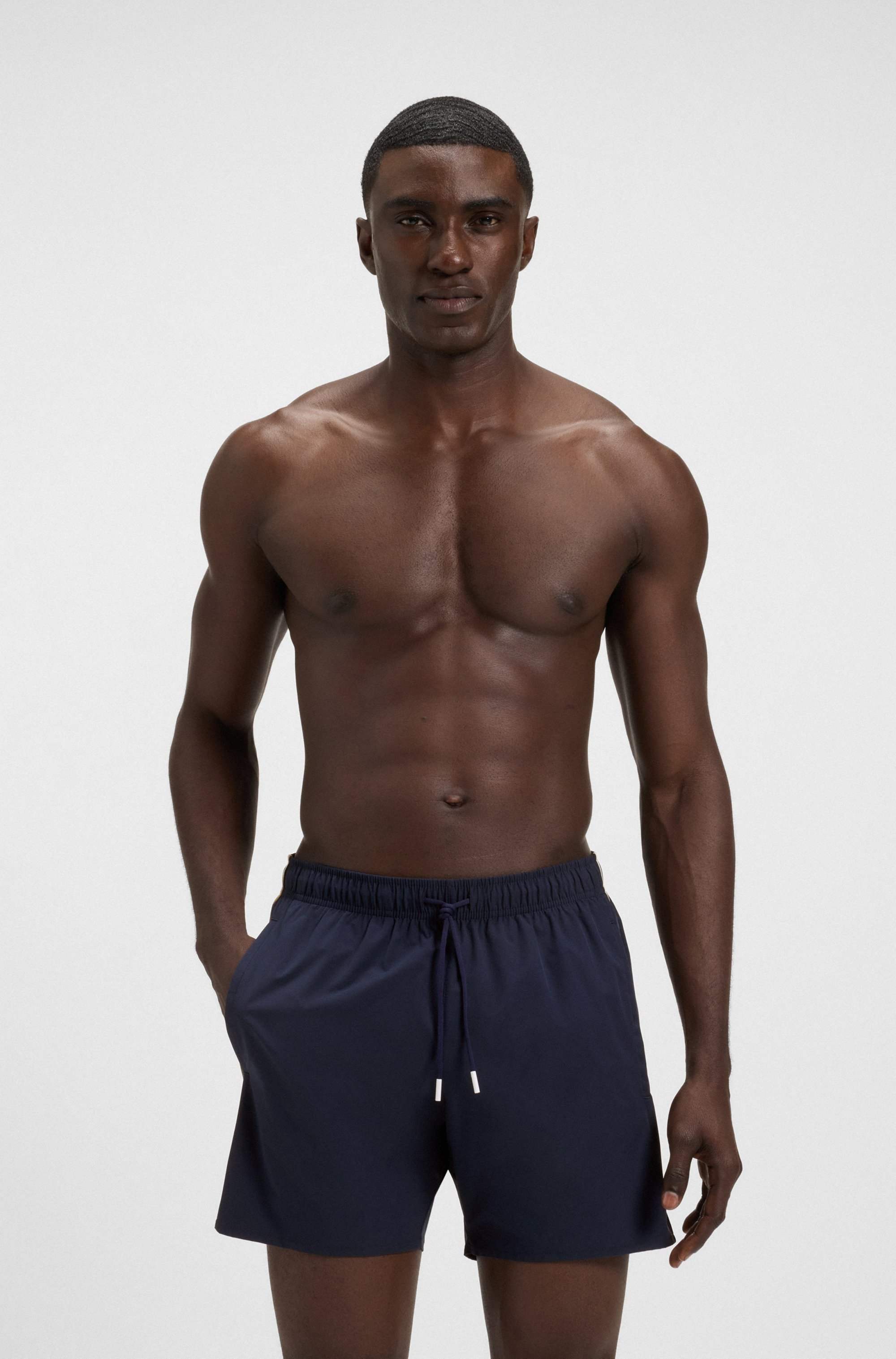 Swim shorts with signature stripe and logo