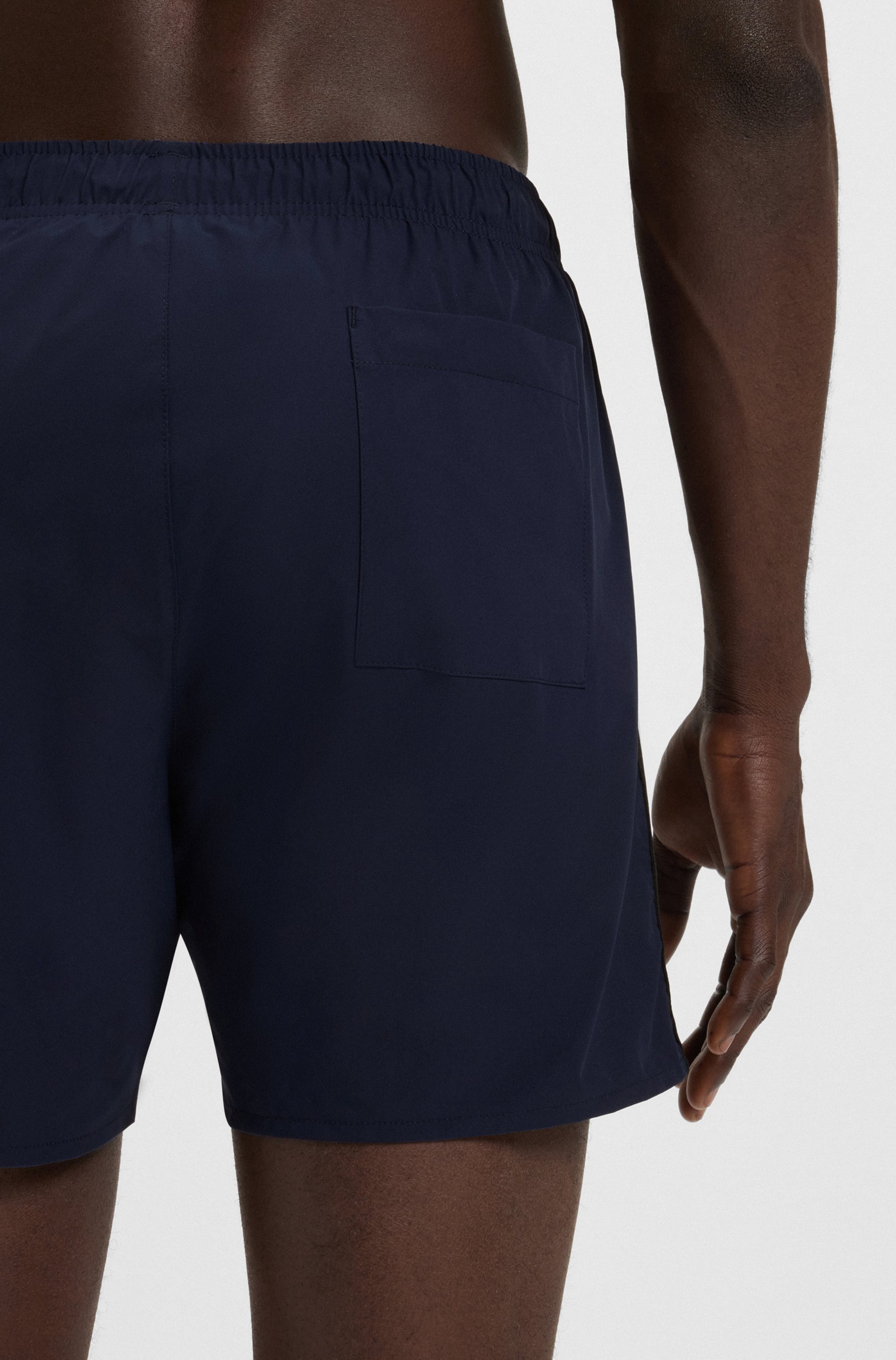 Swim shorts with signature stripe and logo