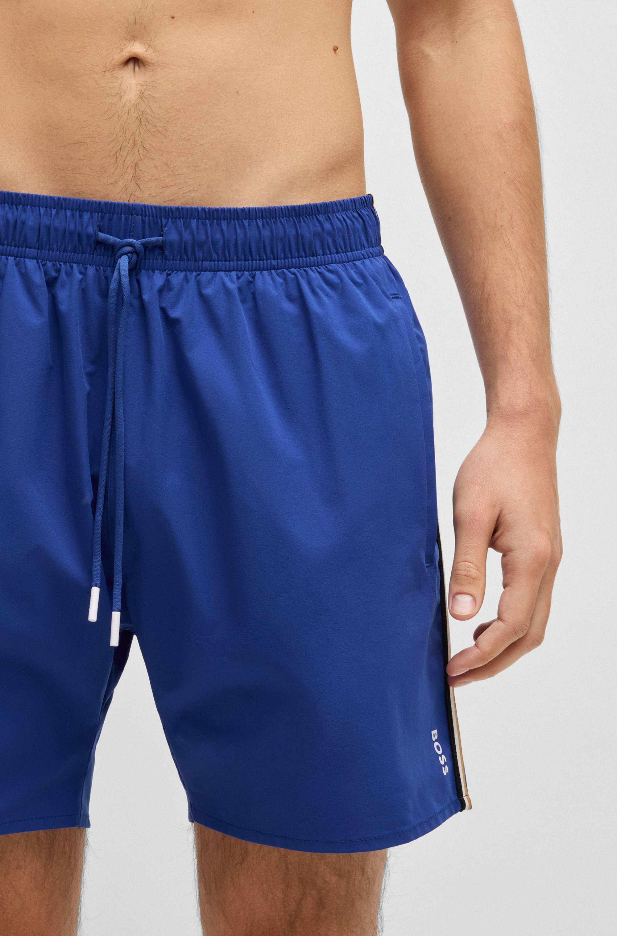 Swim shorts with signature stripe and logo