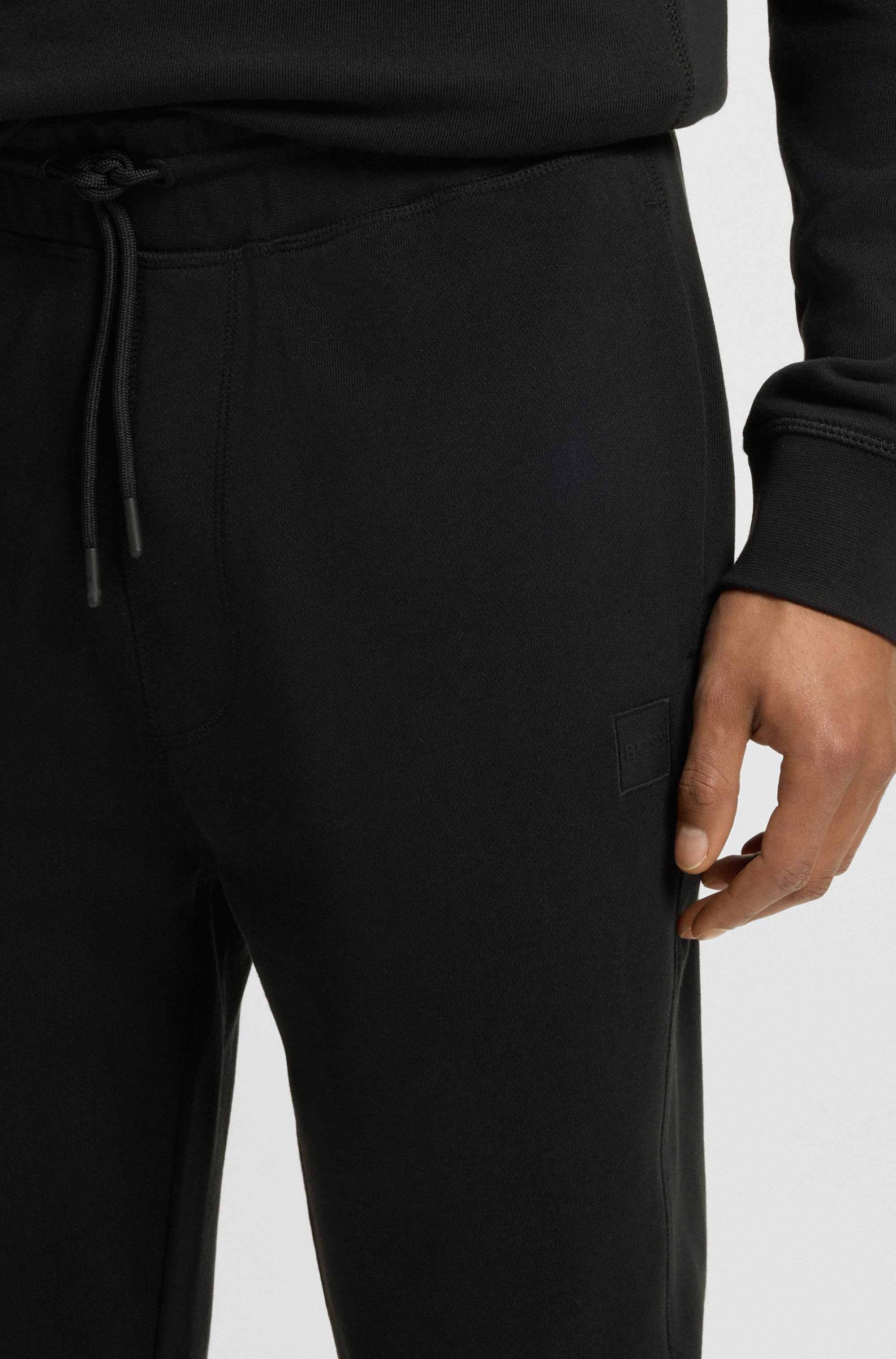 Cotton-terry tracksuit bottoms with logo patch