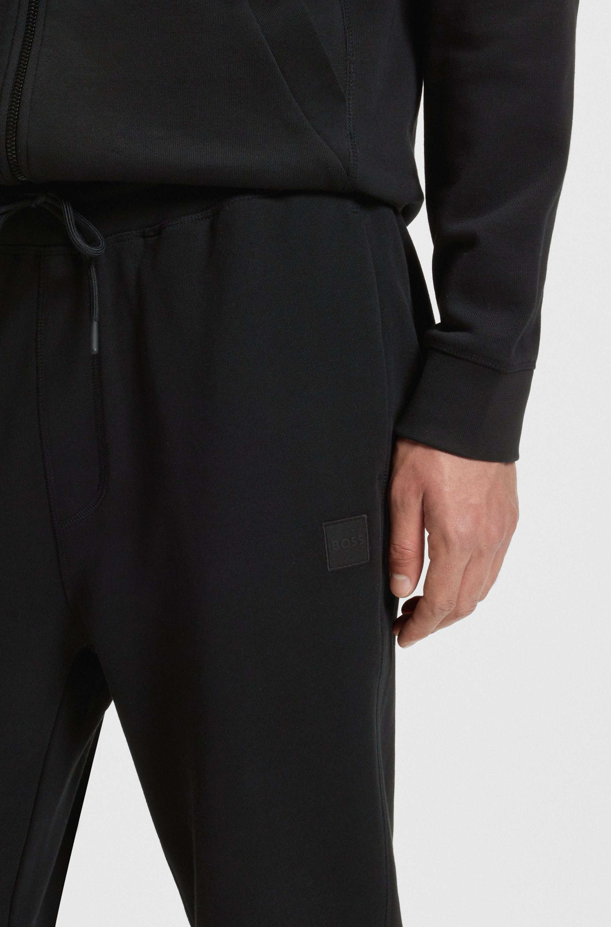 Cotton-terry tracksuit bottoms with logo patch