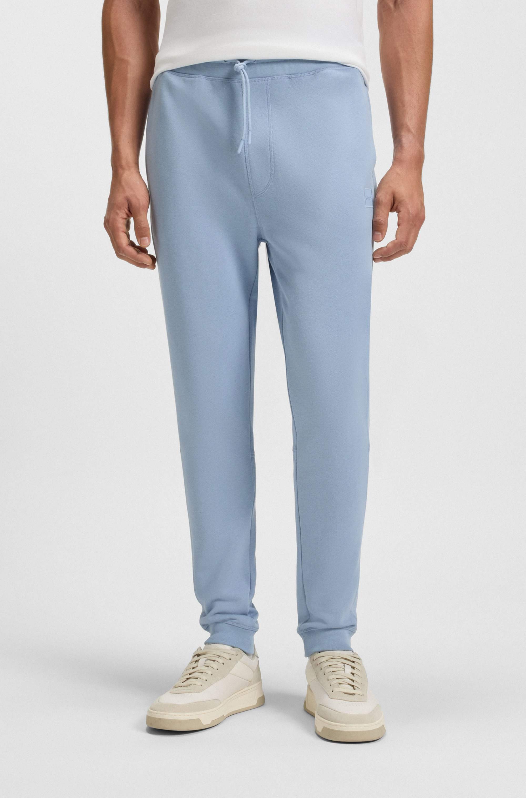 Cotton-terry tracksuit bottoms with logo patch