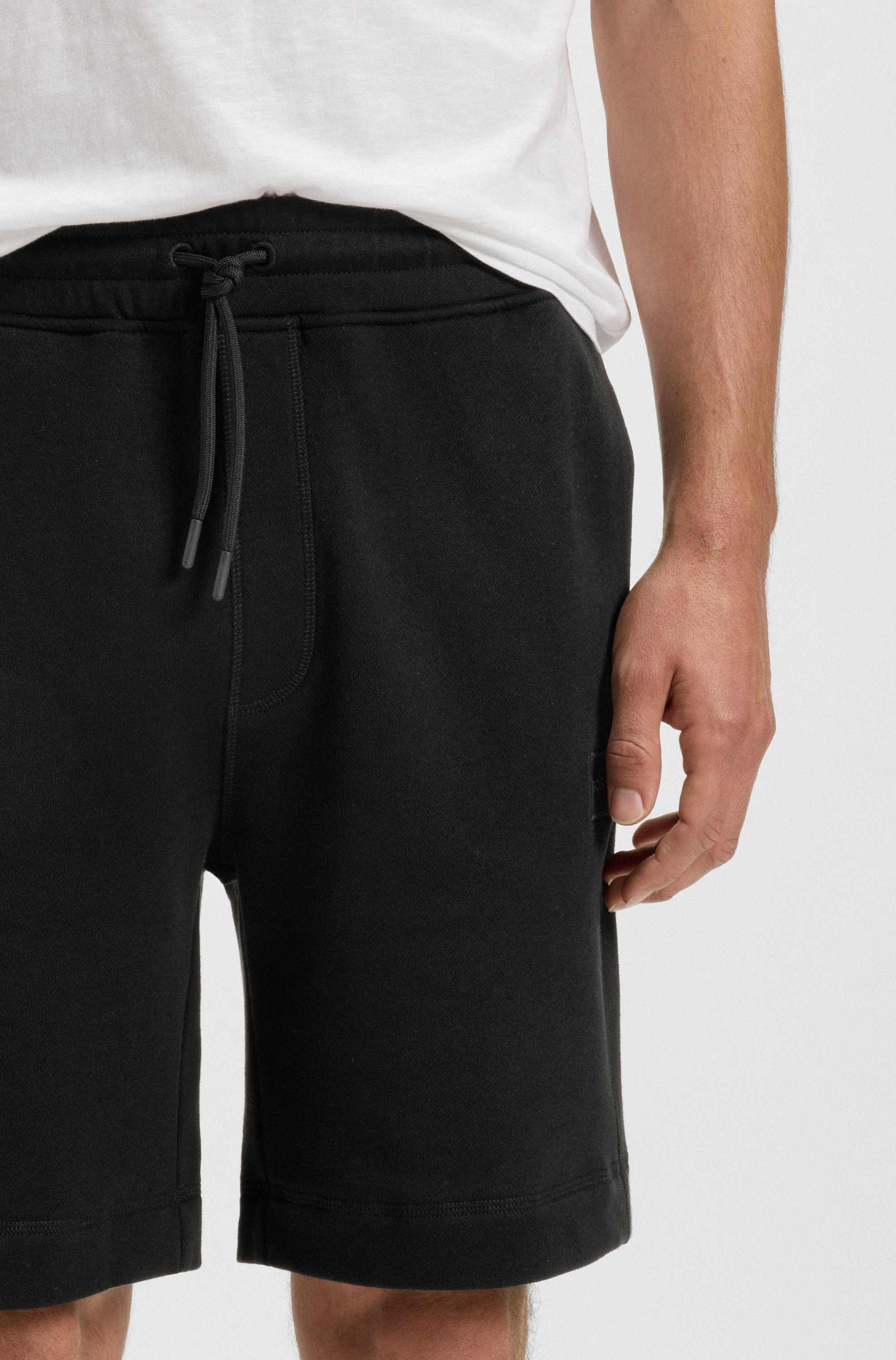 Relaxed-fit shorts in cotton terry with logo badge