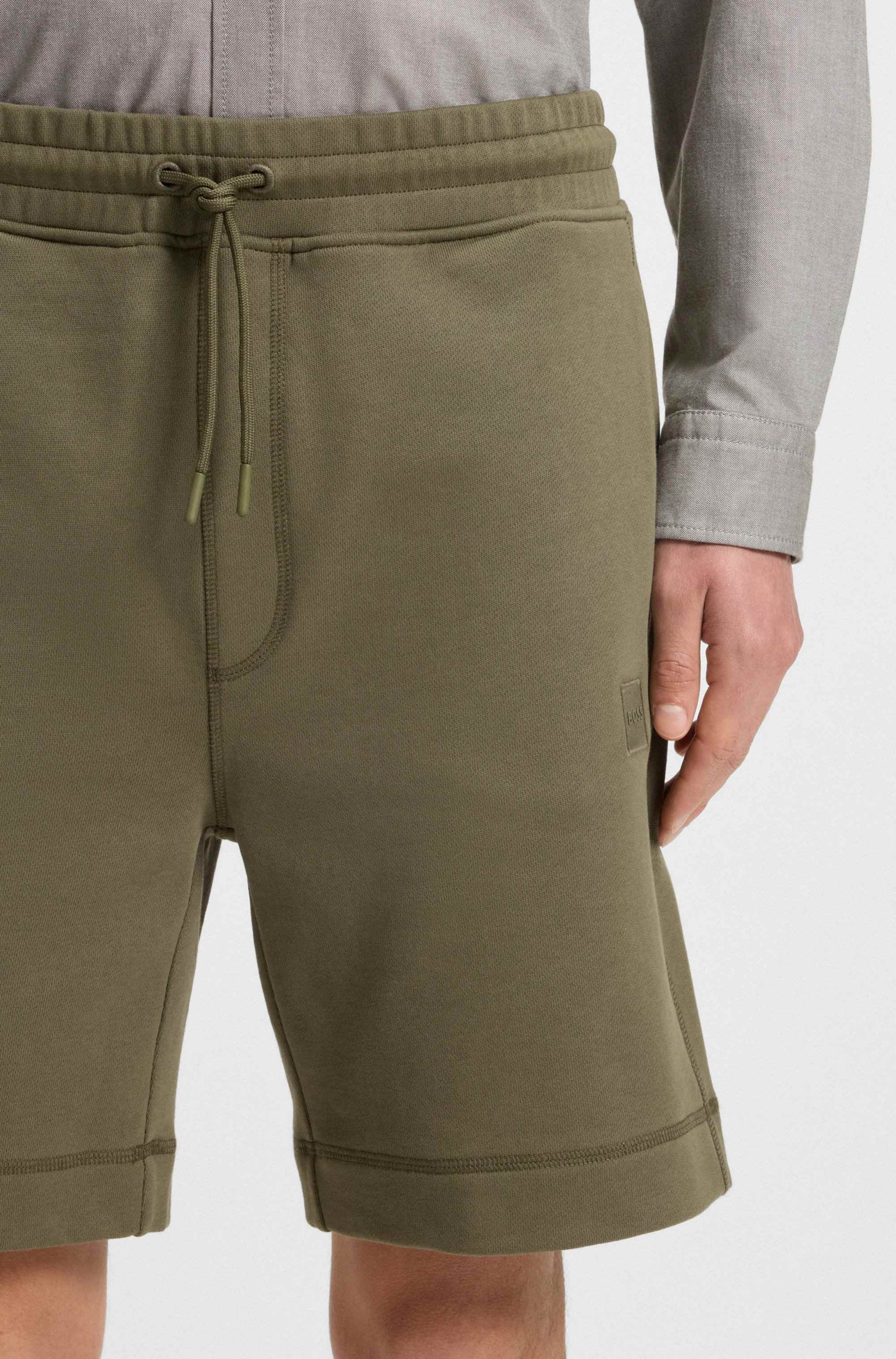 Relaxed-fit shorts in cotton terry with logo badge