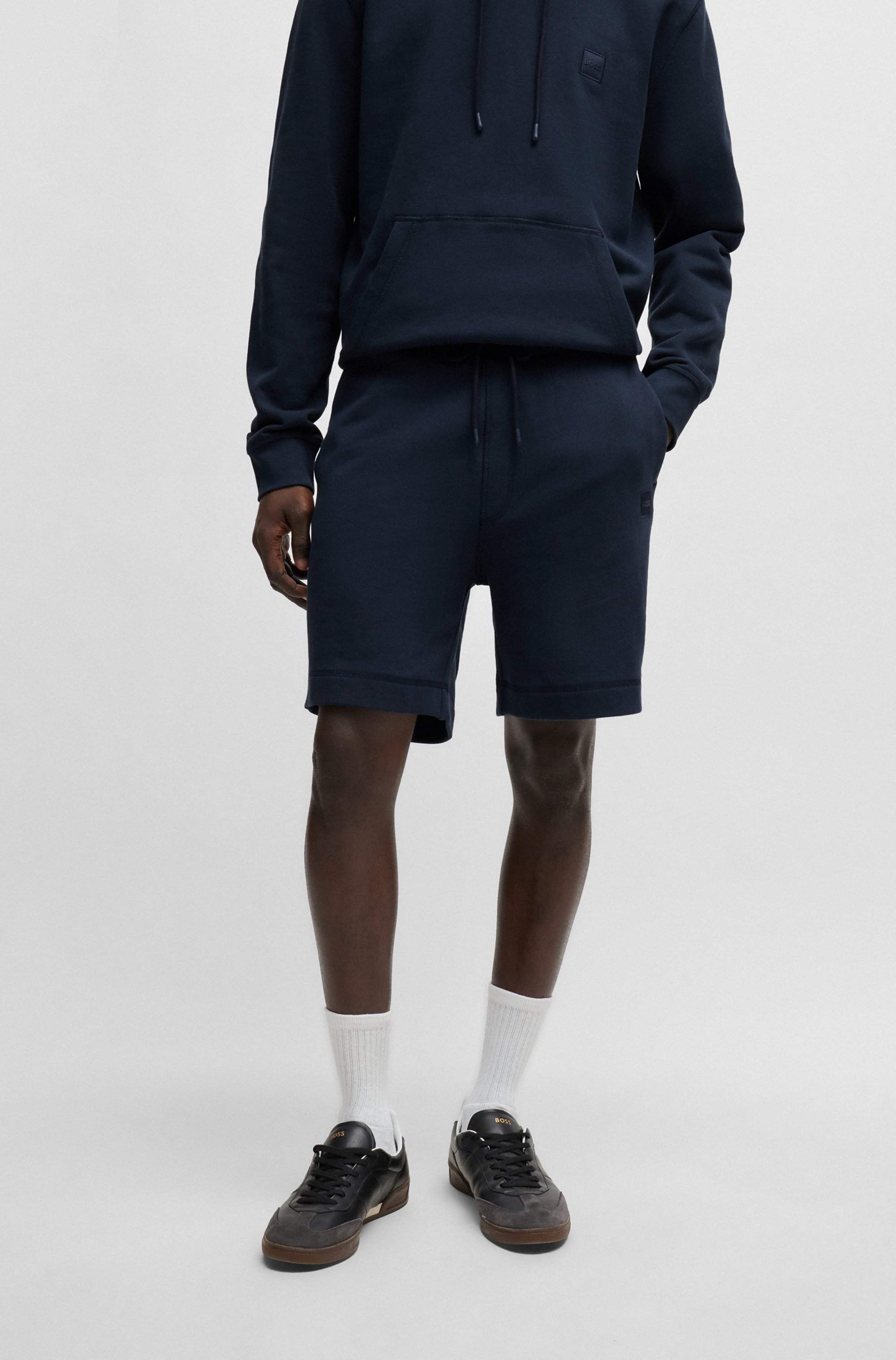 Relaxed-fit shorts in cotton terry with logo badge