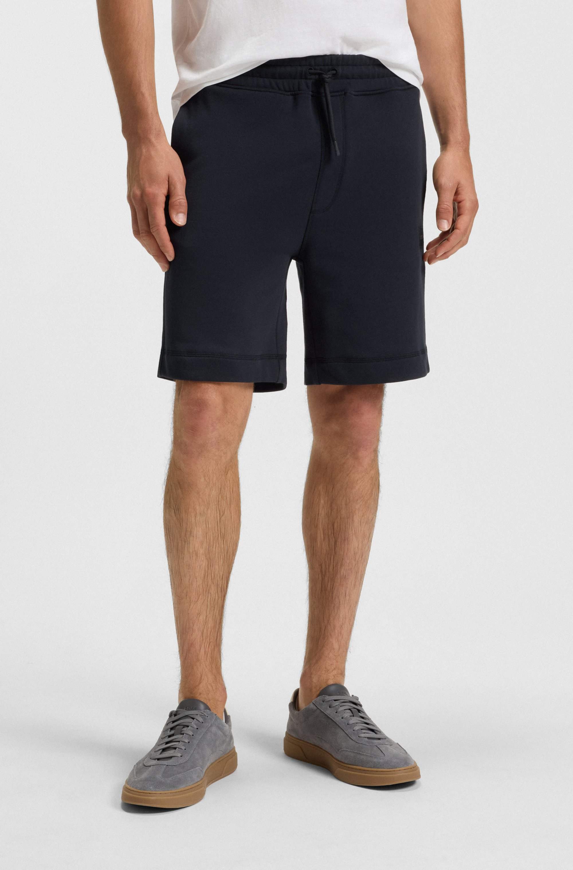 Relaxed-fit shorts in cotton terry with logo badge