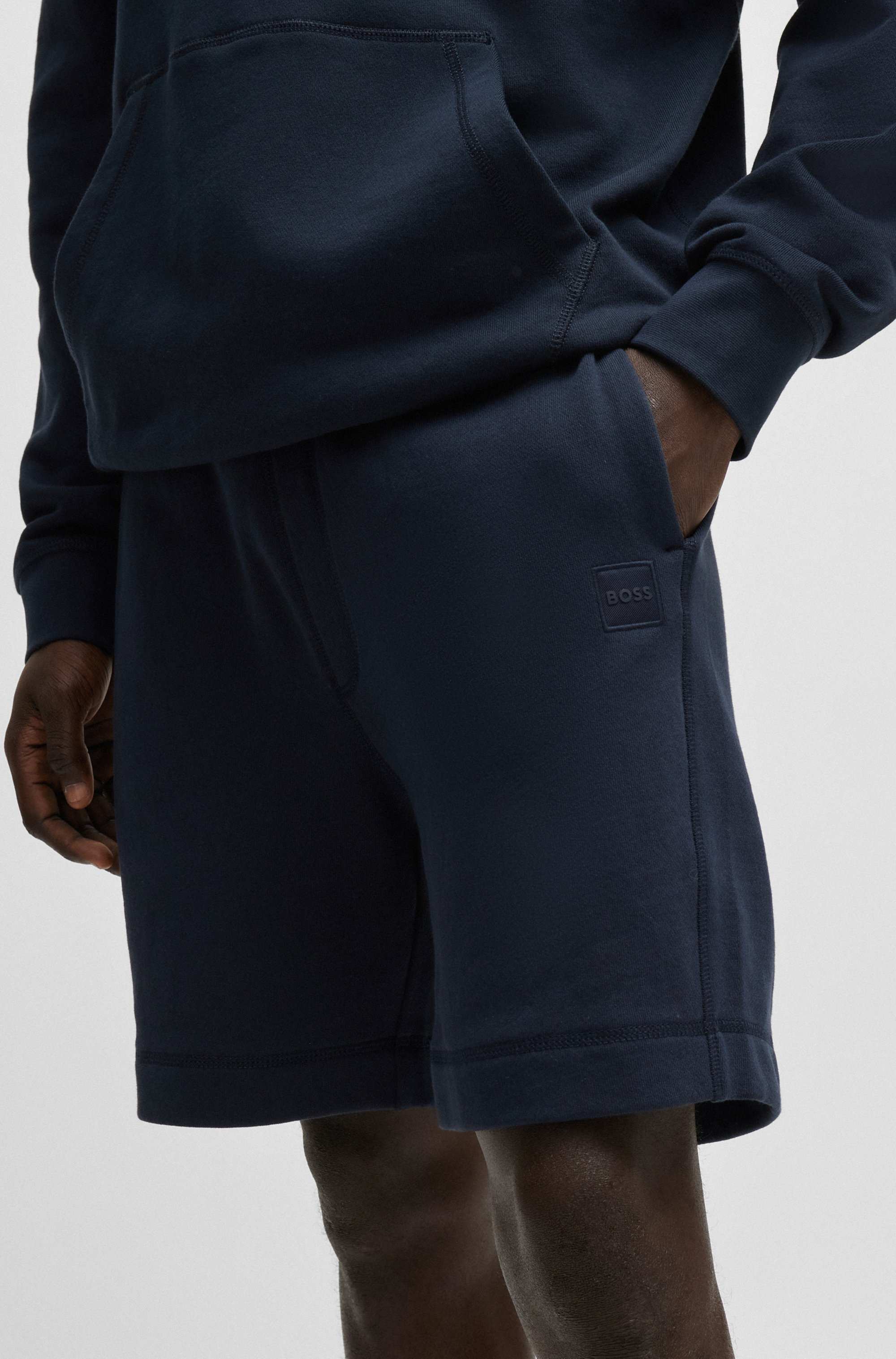 Relaxed-fit shorts in cotton terry with logo badge
