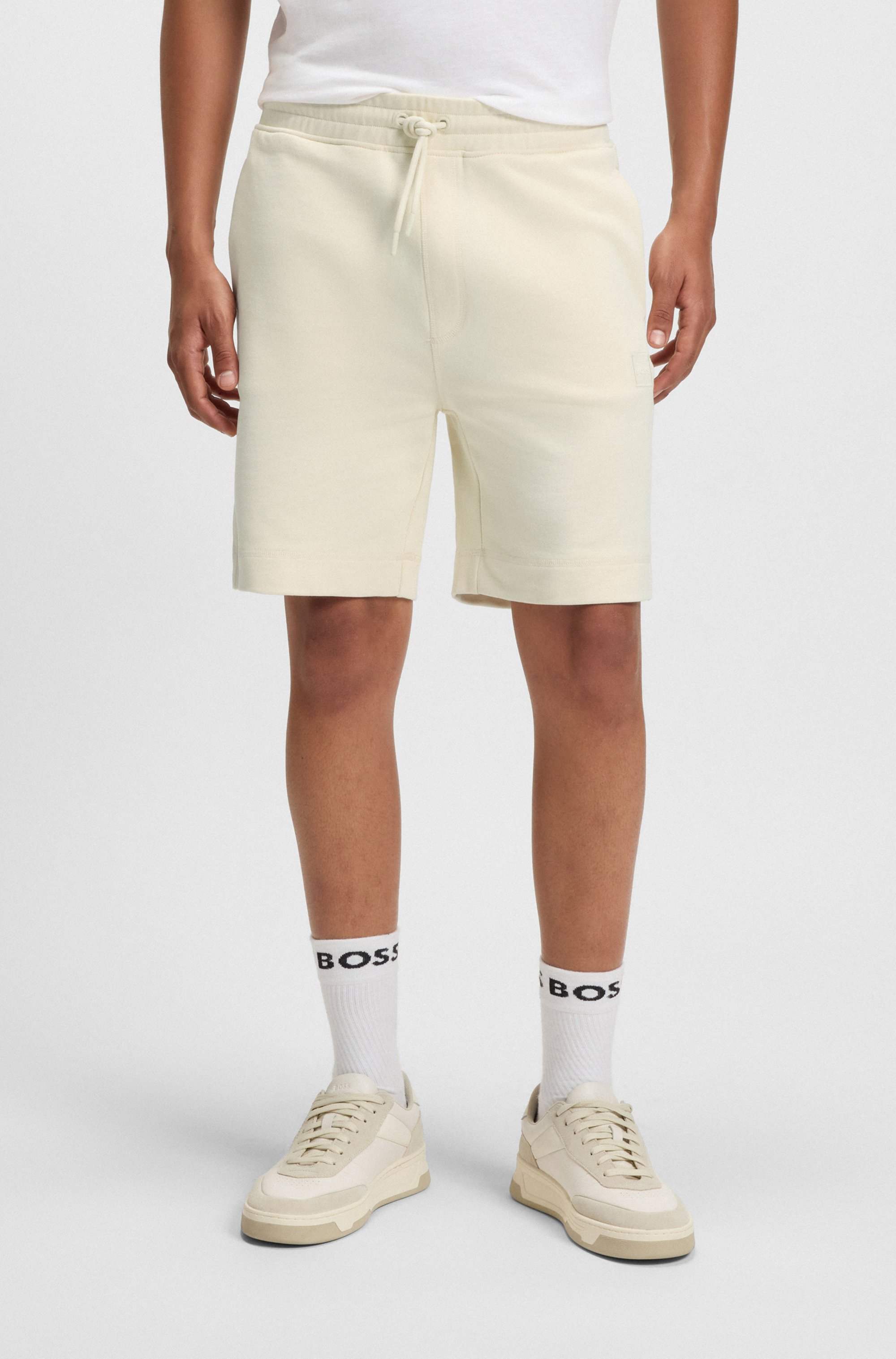 Drawstring shorts in cotton terry with logo badge