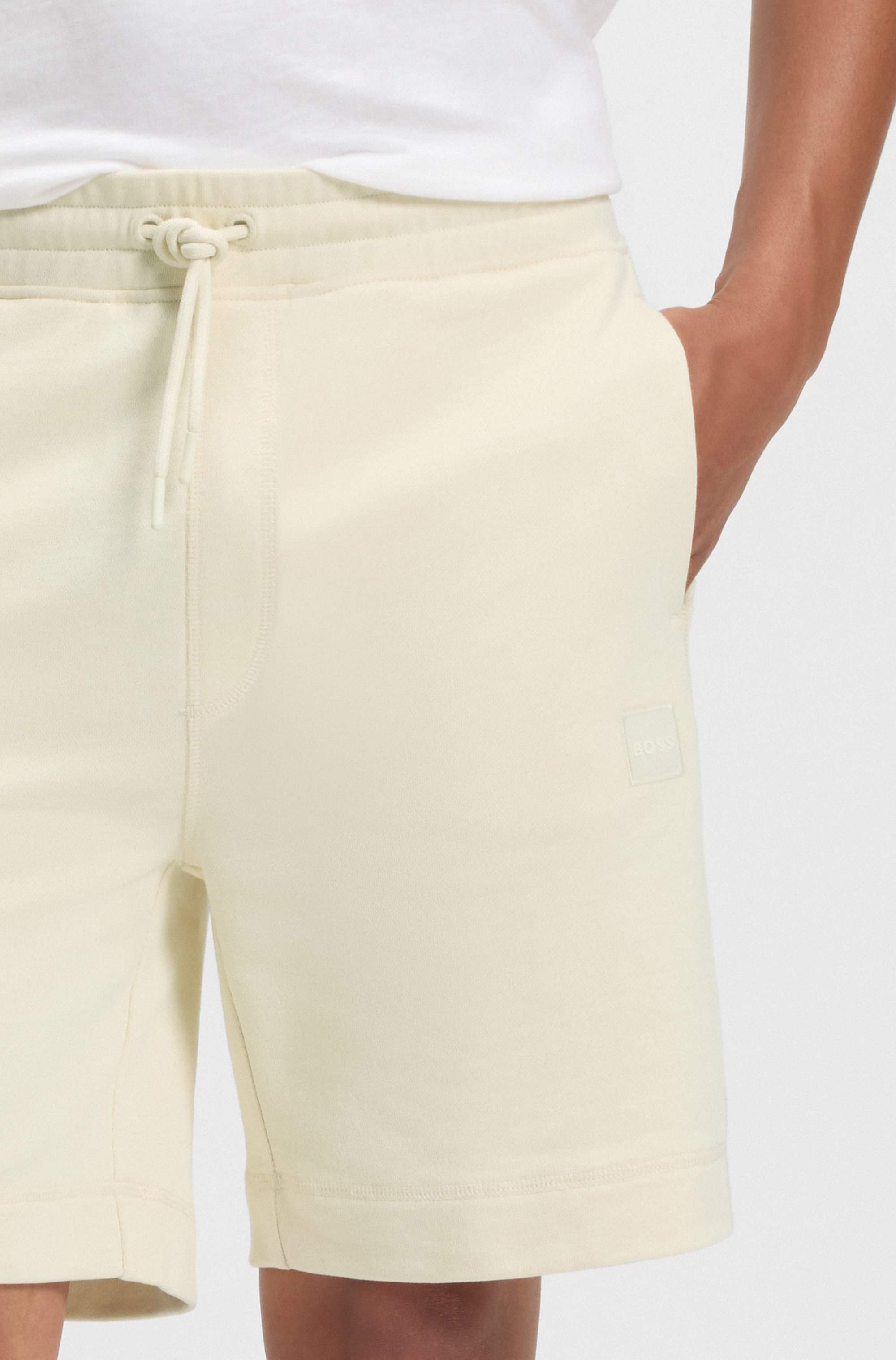 Drawstring shorts in cotton terry with logo badge