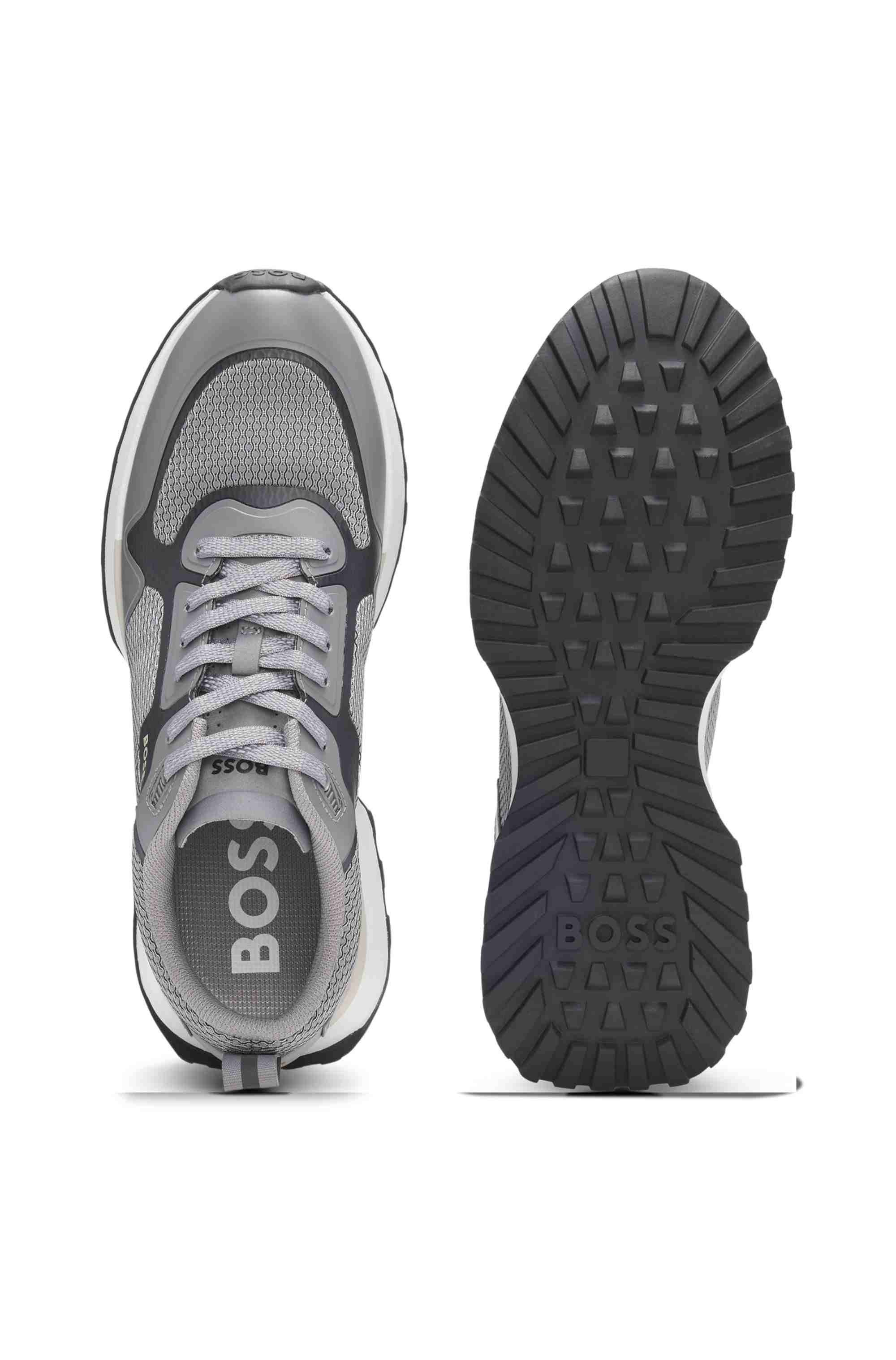 Mixed-material trainers with mesh details and branding