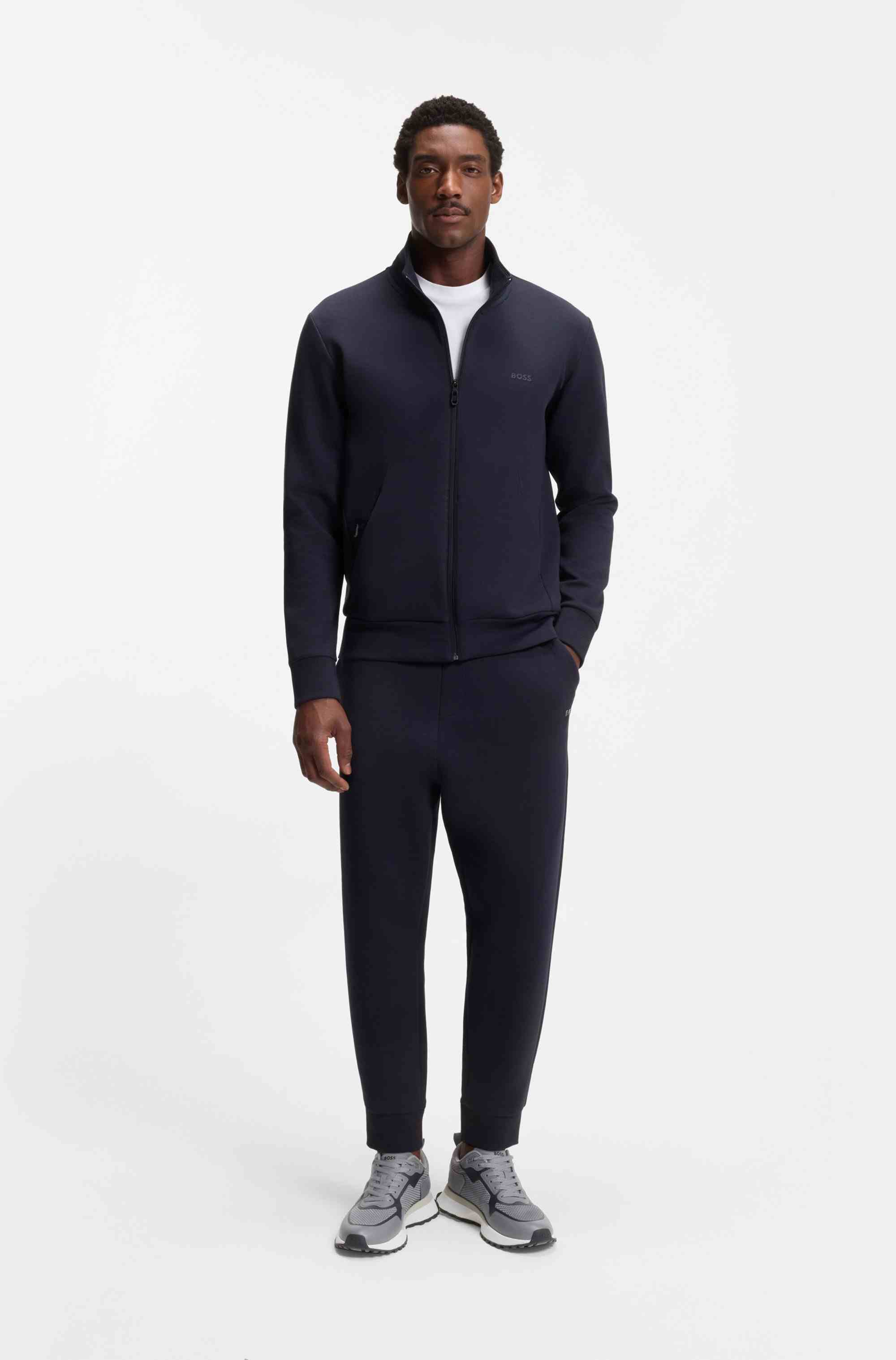 Mixed-material trainers with mesh details and branding