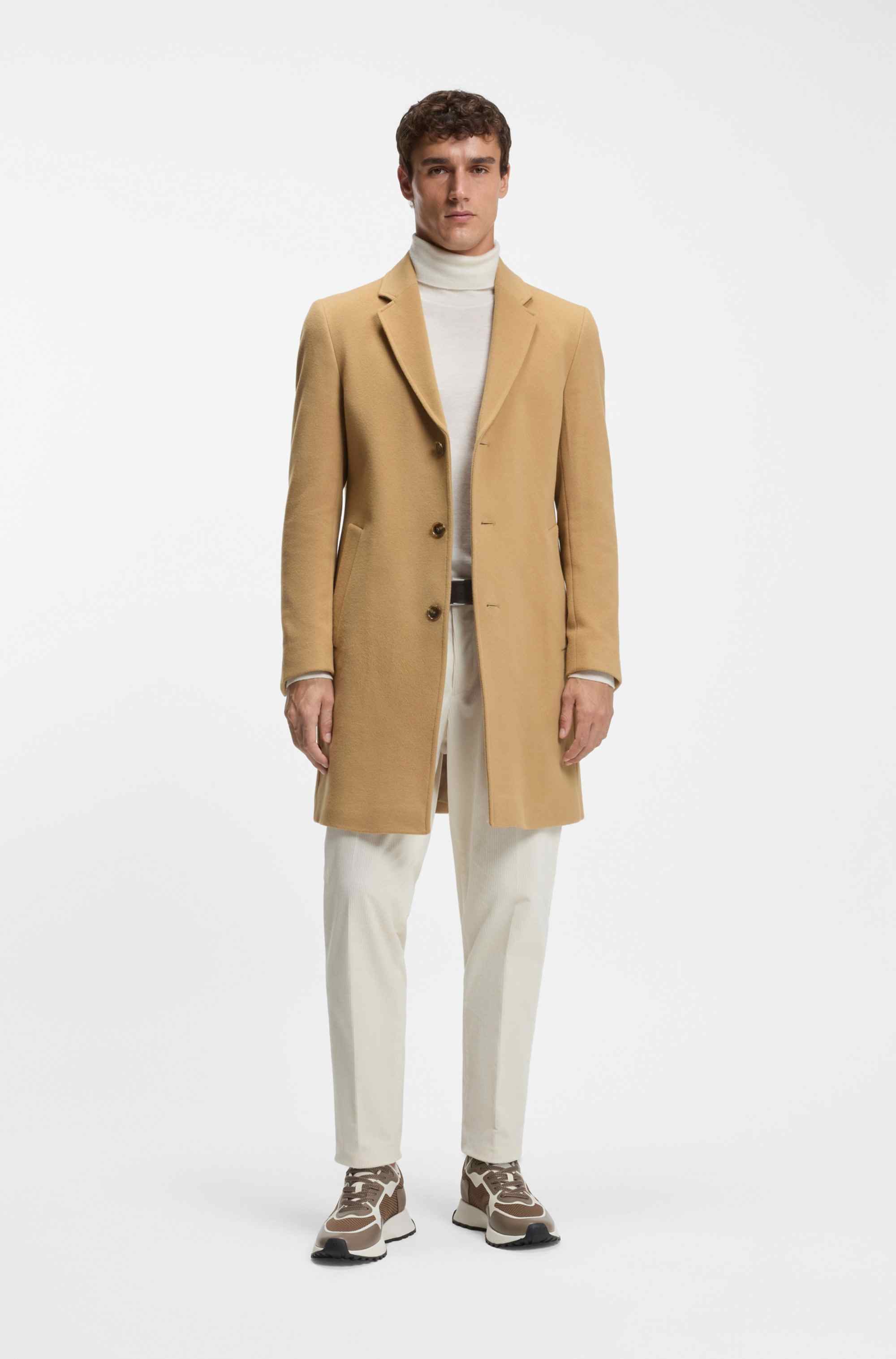 Mixed-material trainers with mesh details and branding