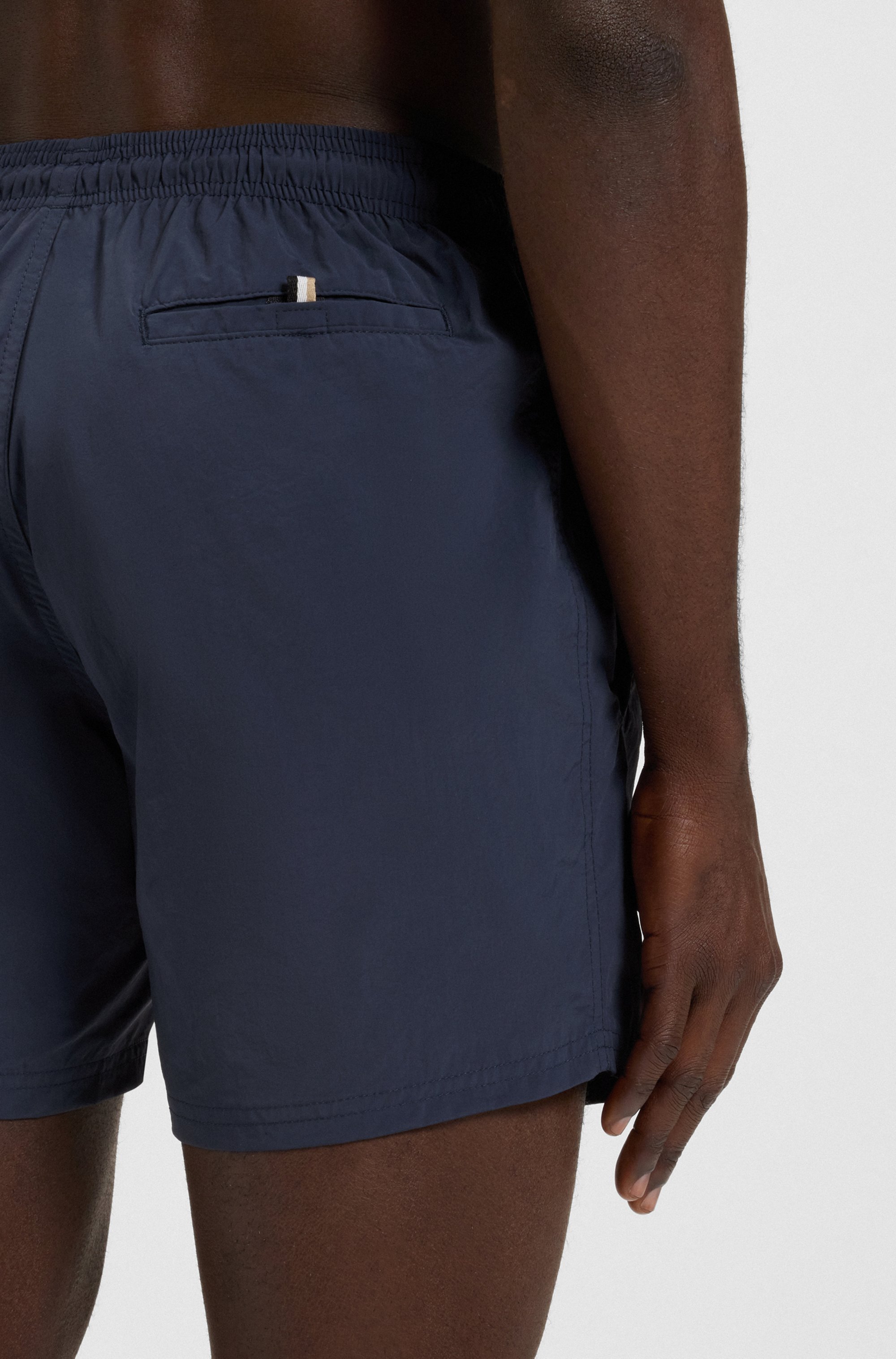 Quick-dry swim shorts with vertical logo print