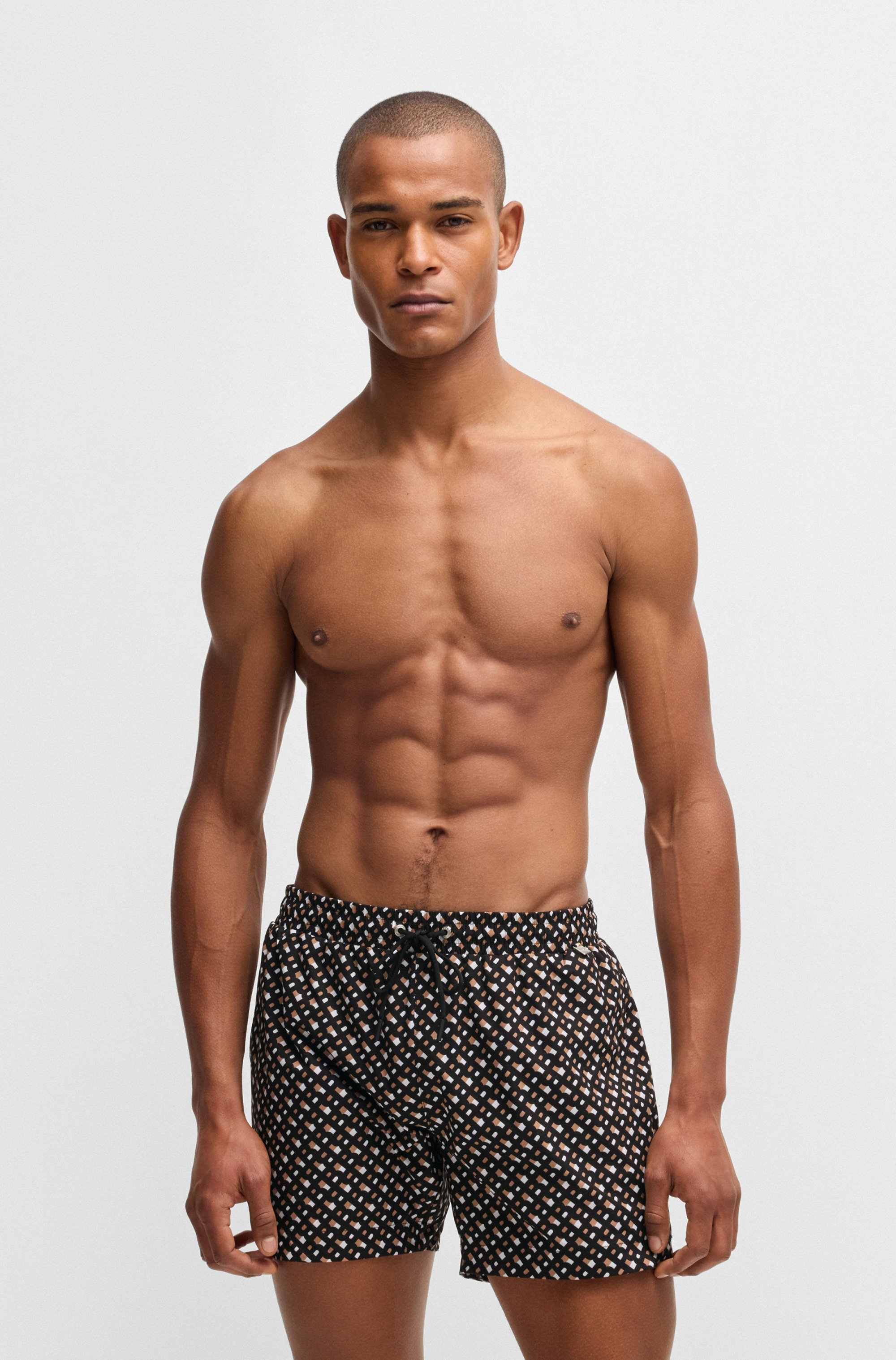 Fully lined quick-dry swim shorts with monogram print