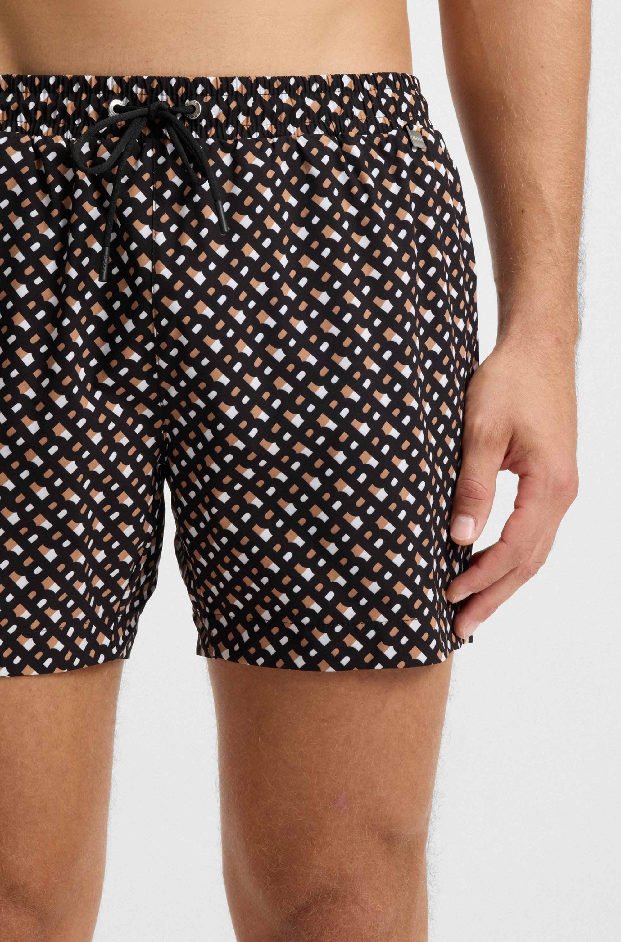 Fully lined quick-dry swim shorts with monogram print