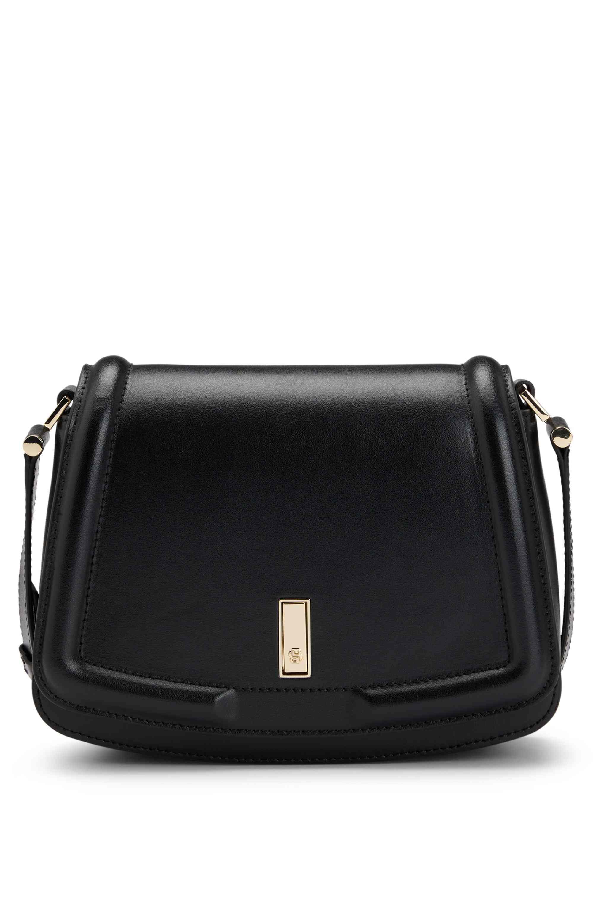 Leather saddle bag with signature hardware and monogram