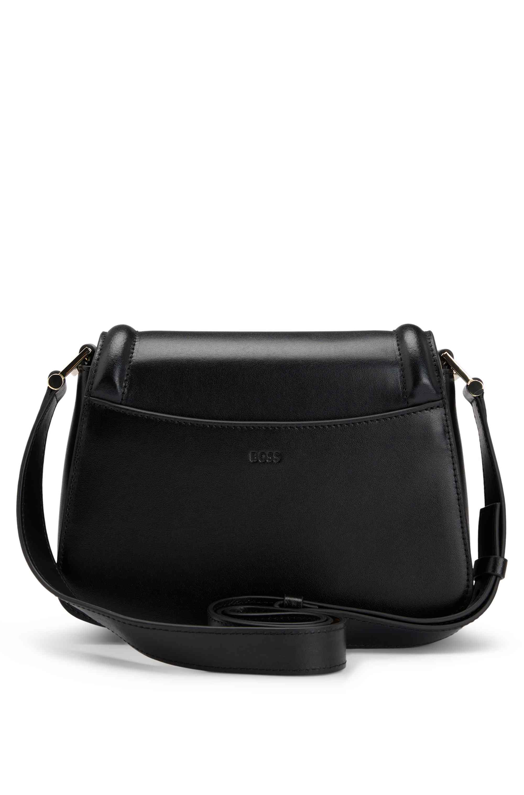 Leather saddle bag with signature hardware and monogram